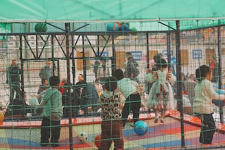 A group of children playing on a trampoline
