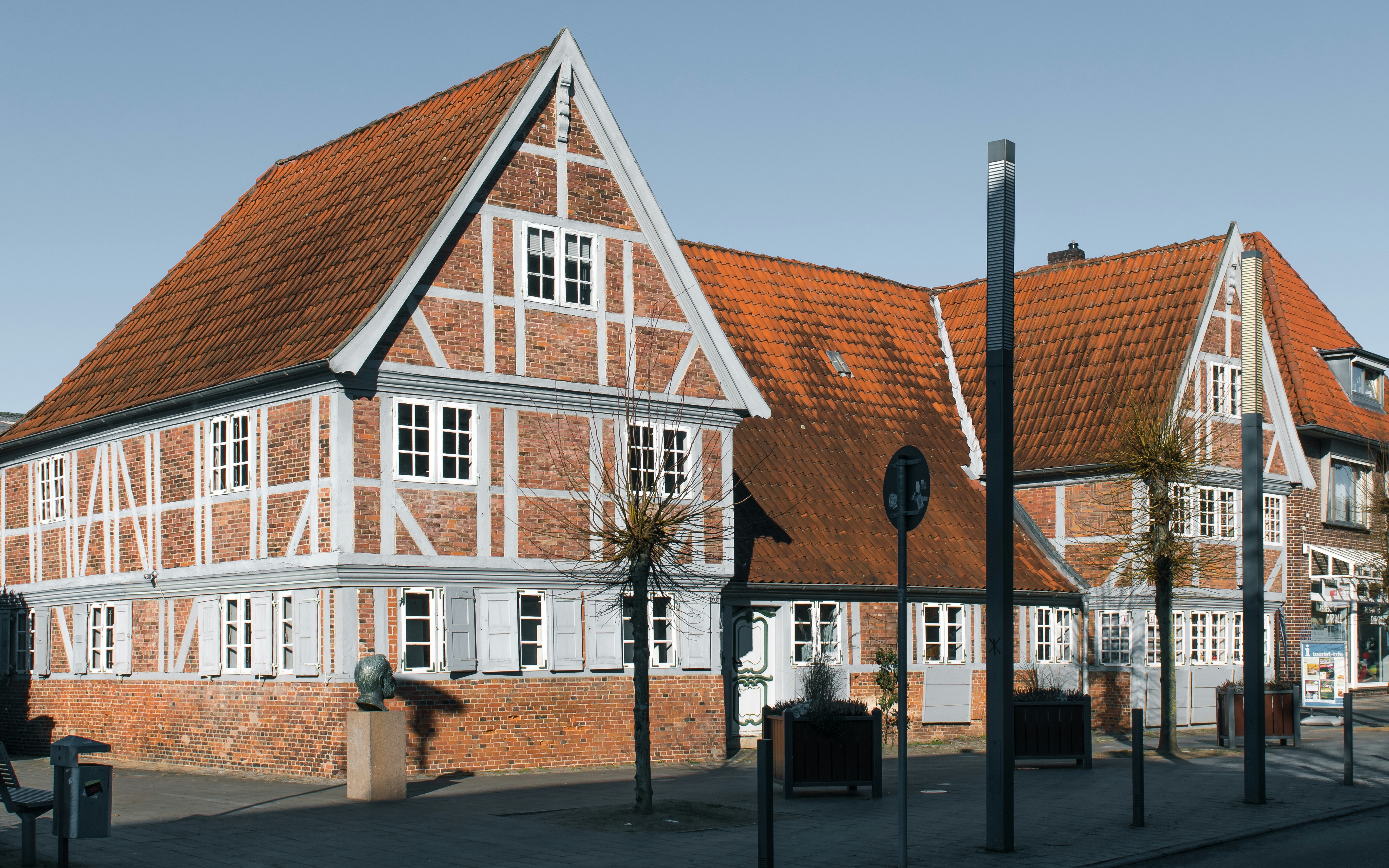A large brown and white building on a city street