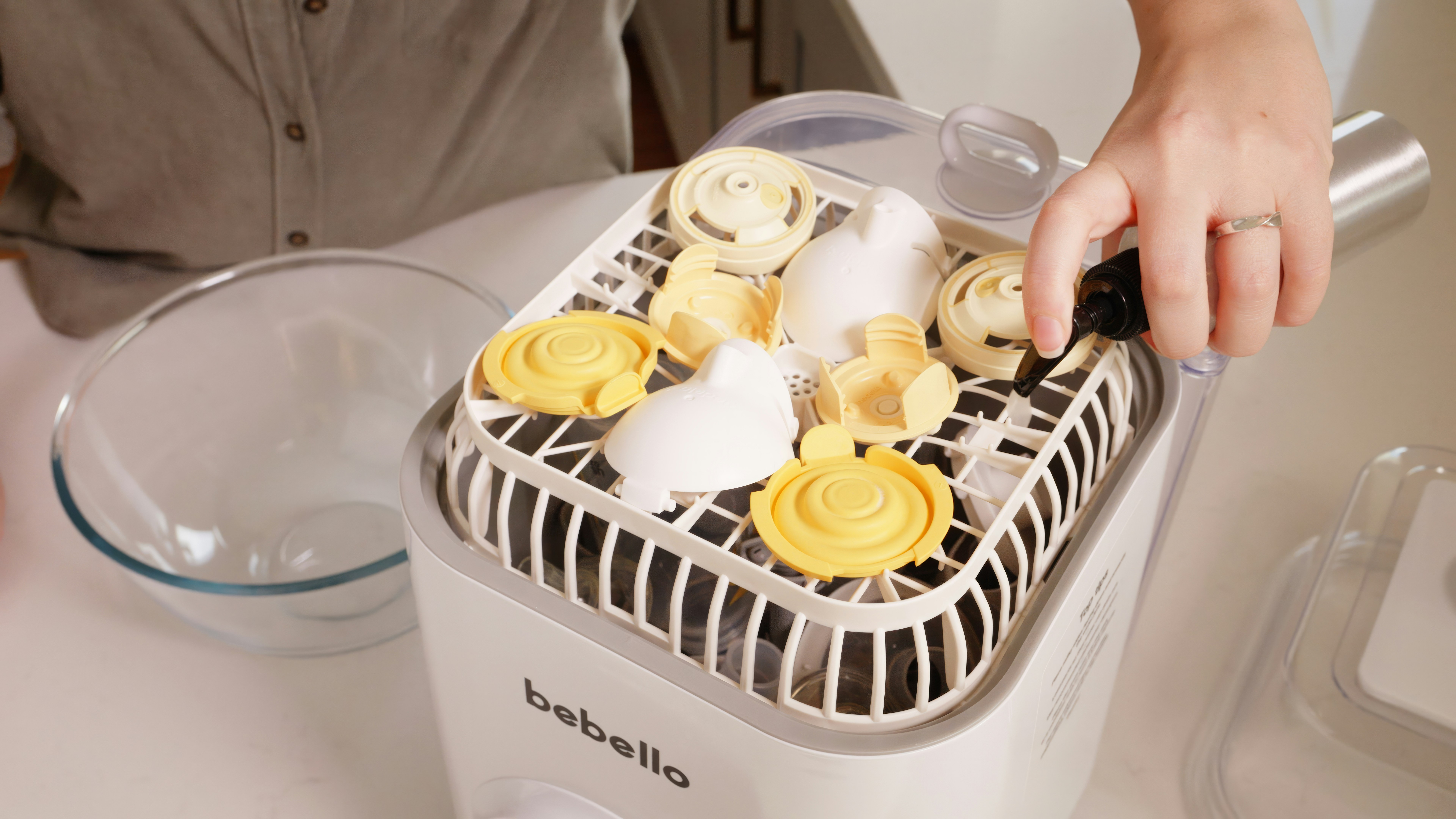 A person putting food into a food processor