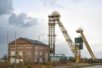 A large crane sitting next to a building