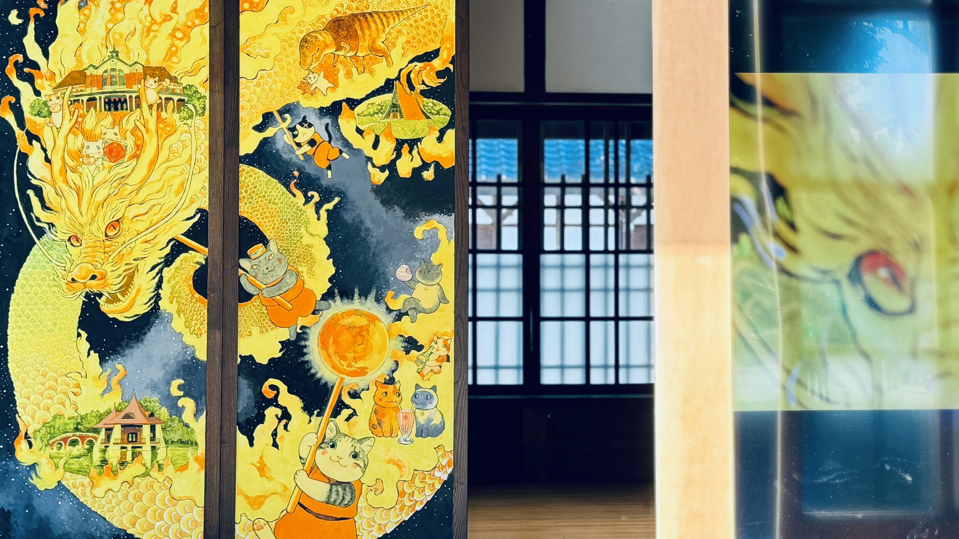 A room with a large painting on the wall