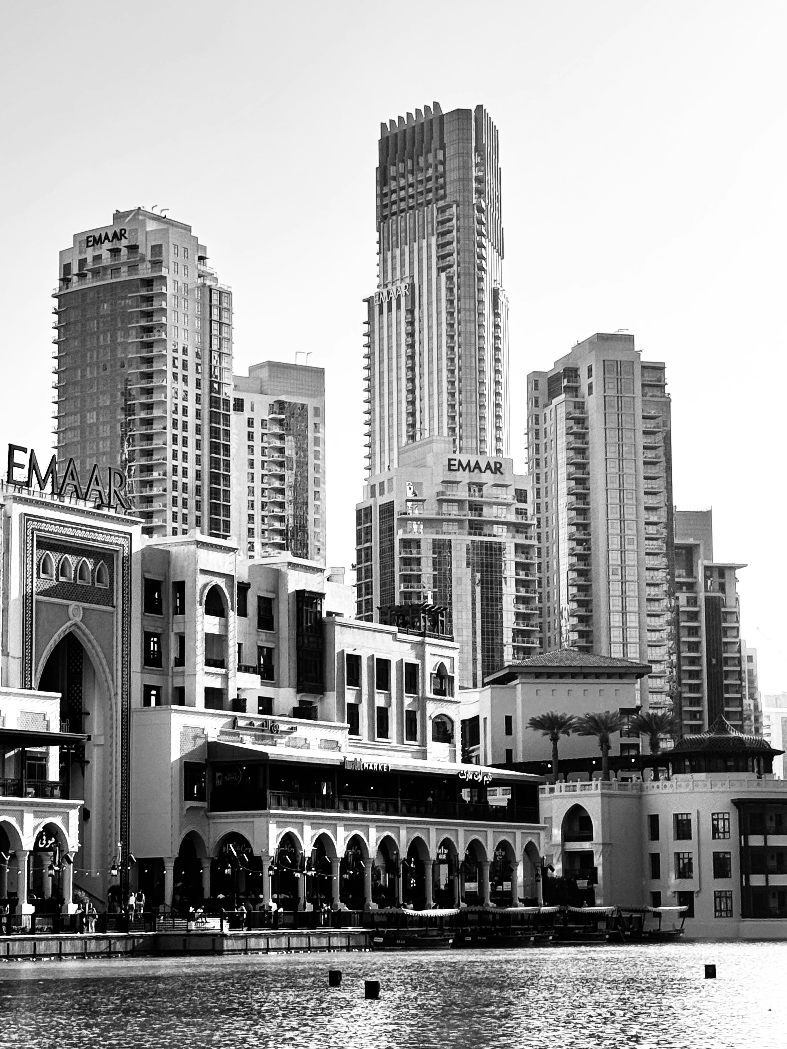 A black and white photo of a city with tall buildings