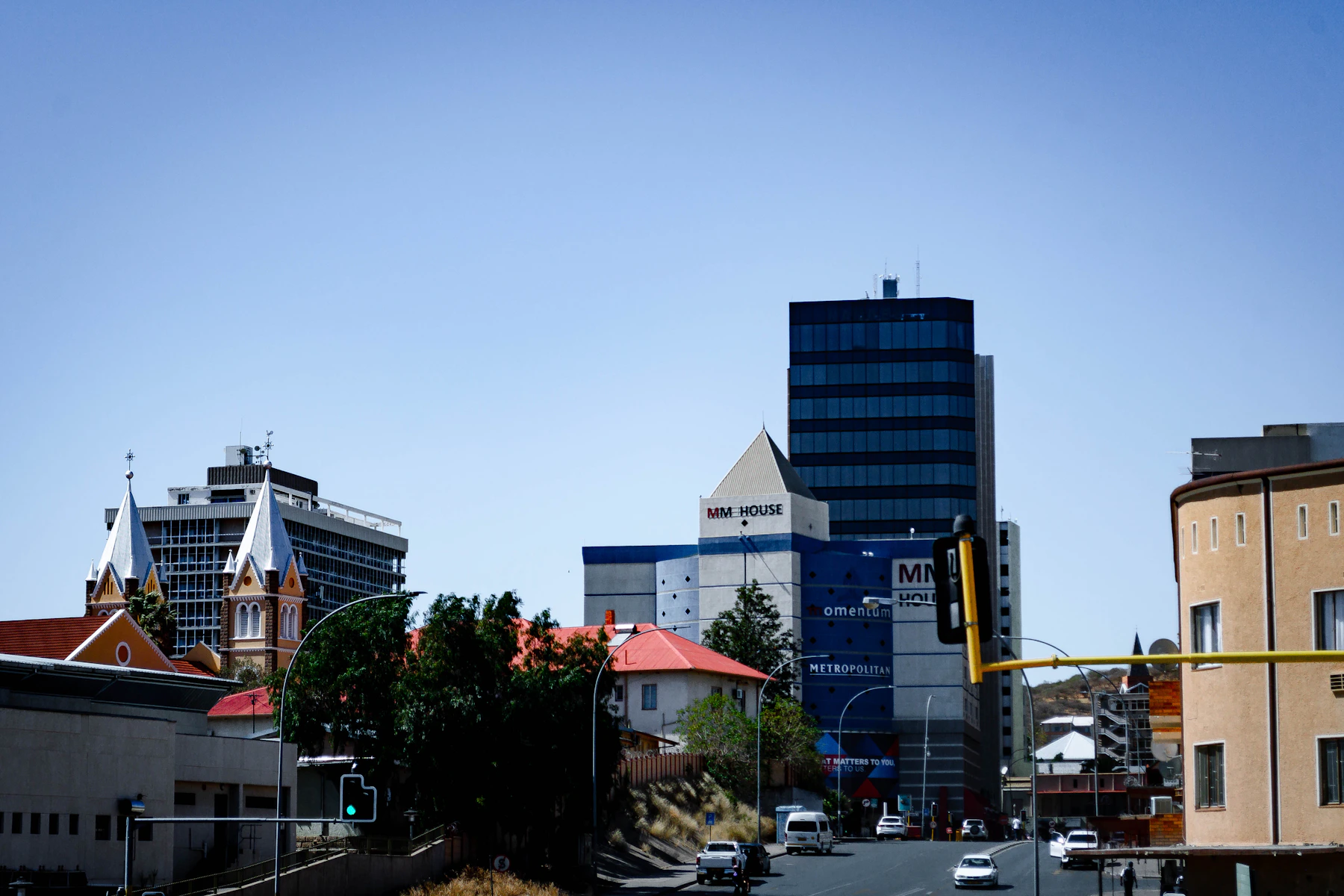 Central Windhoek's streets and modern buildings beneath a clear blue sky