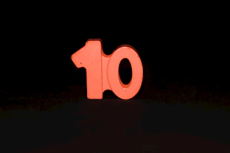 The number ten is lit up in the dark