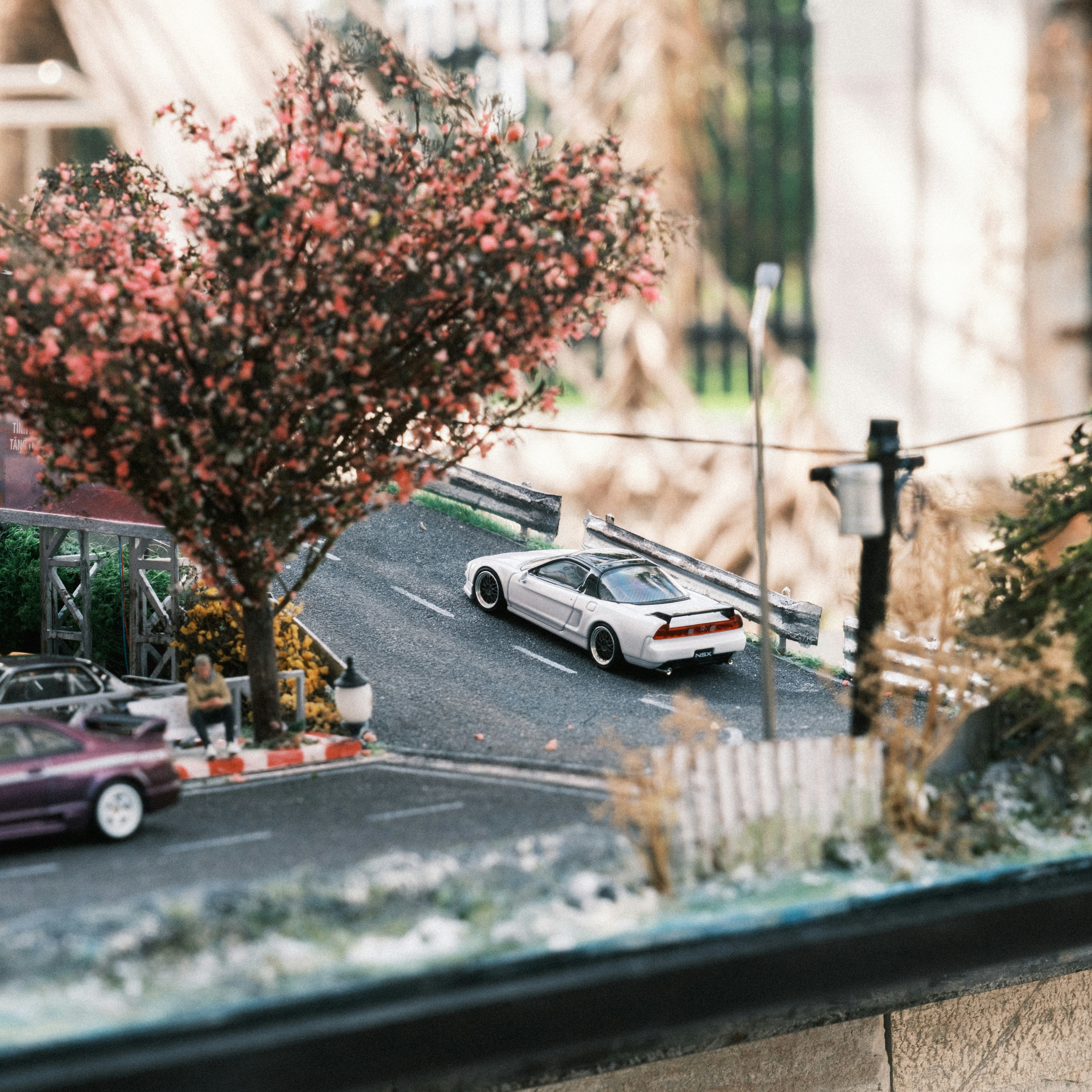 A model of a street with a car on the road