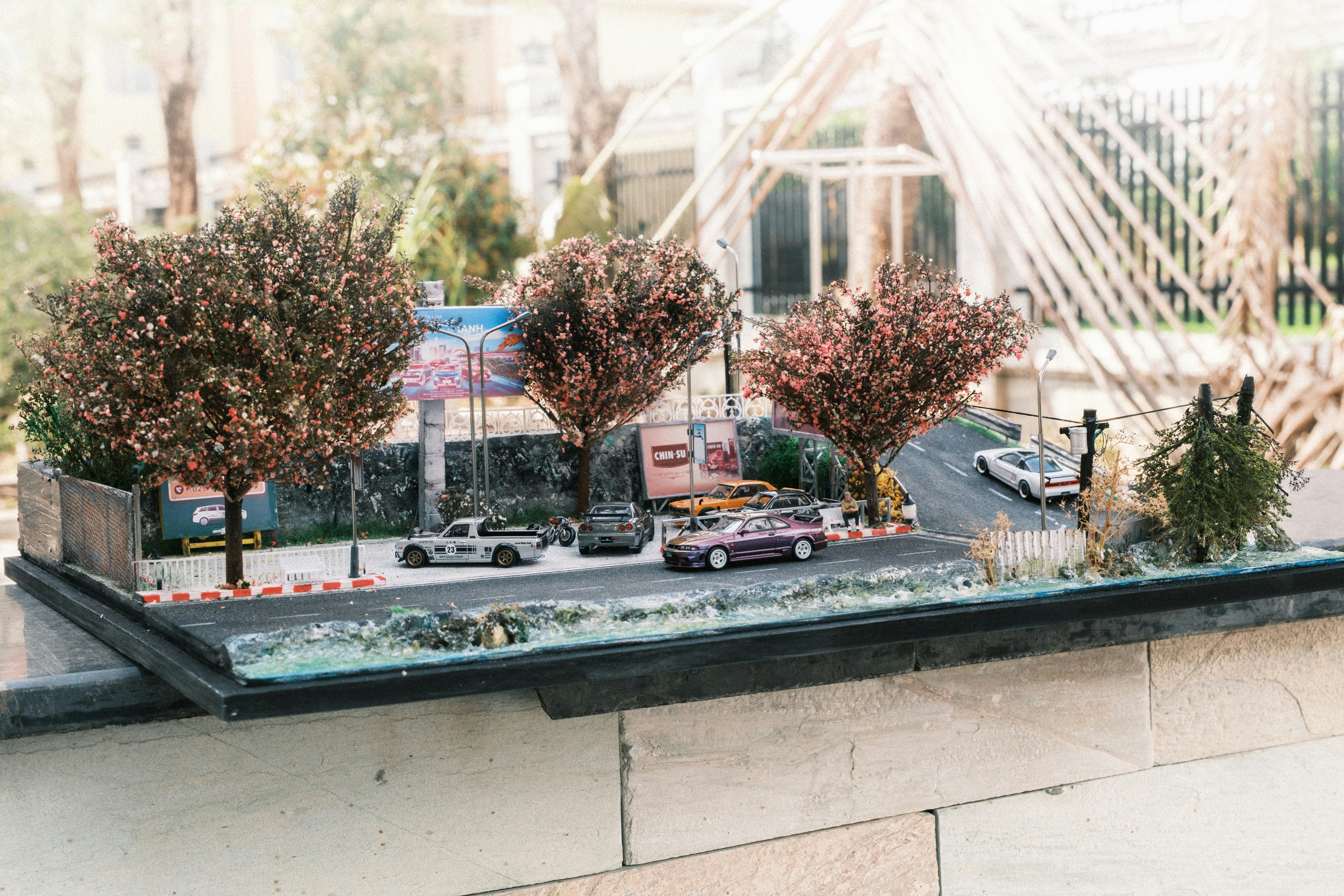 A model of a parking lot with cars and trees