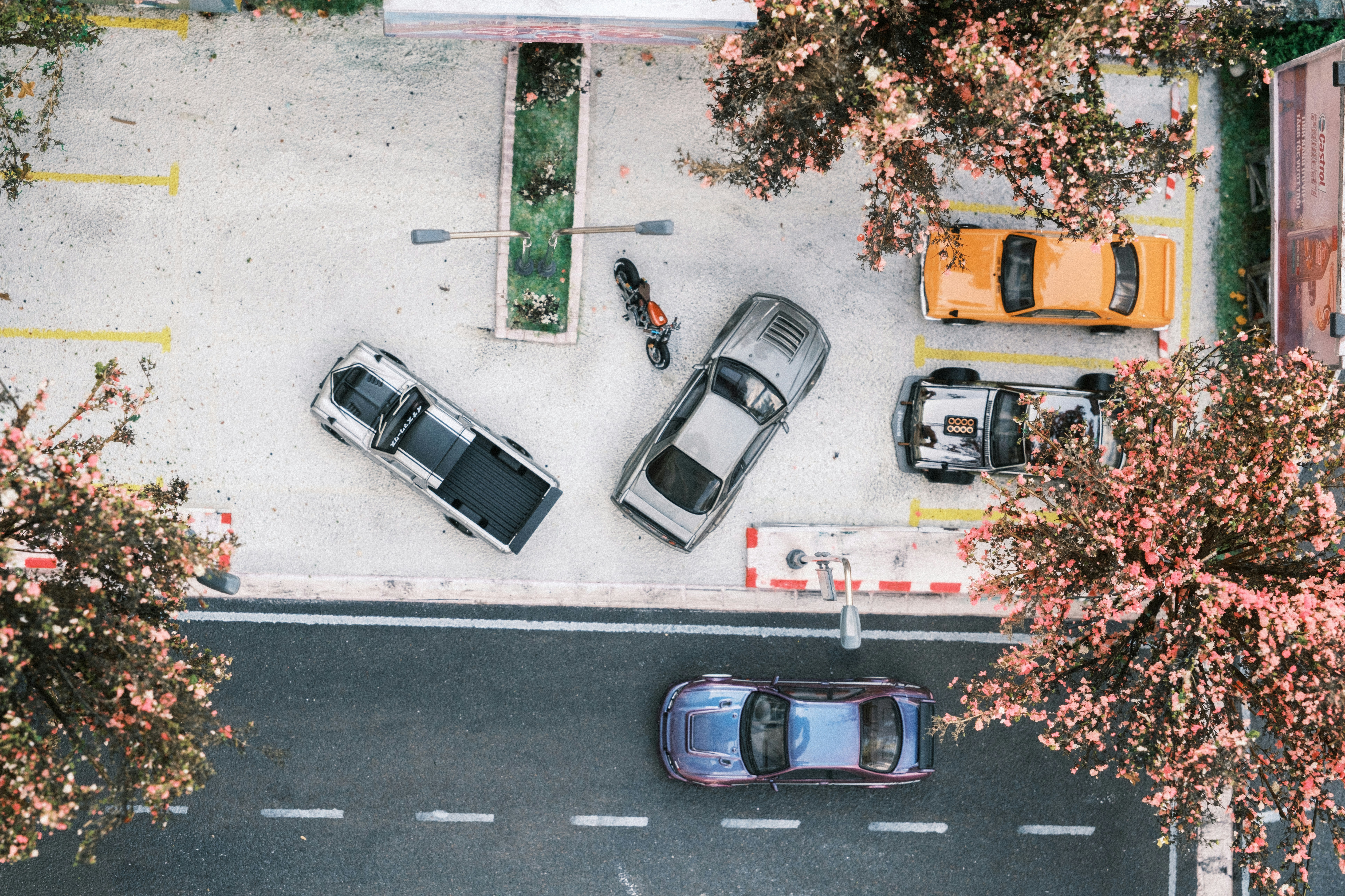 An overhead view of a parking lot with cars parked in it