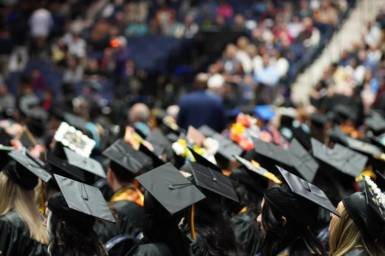 A large group of people in graduation caps and gowns