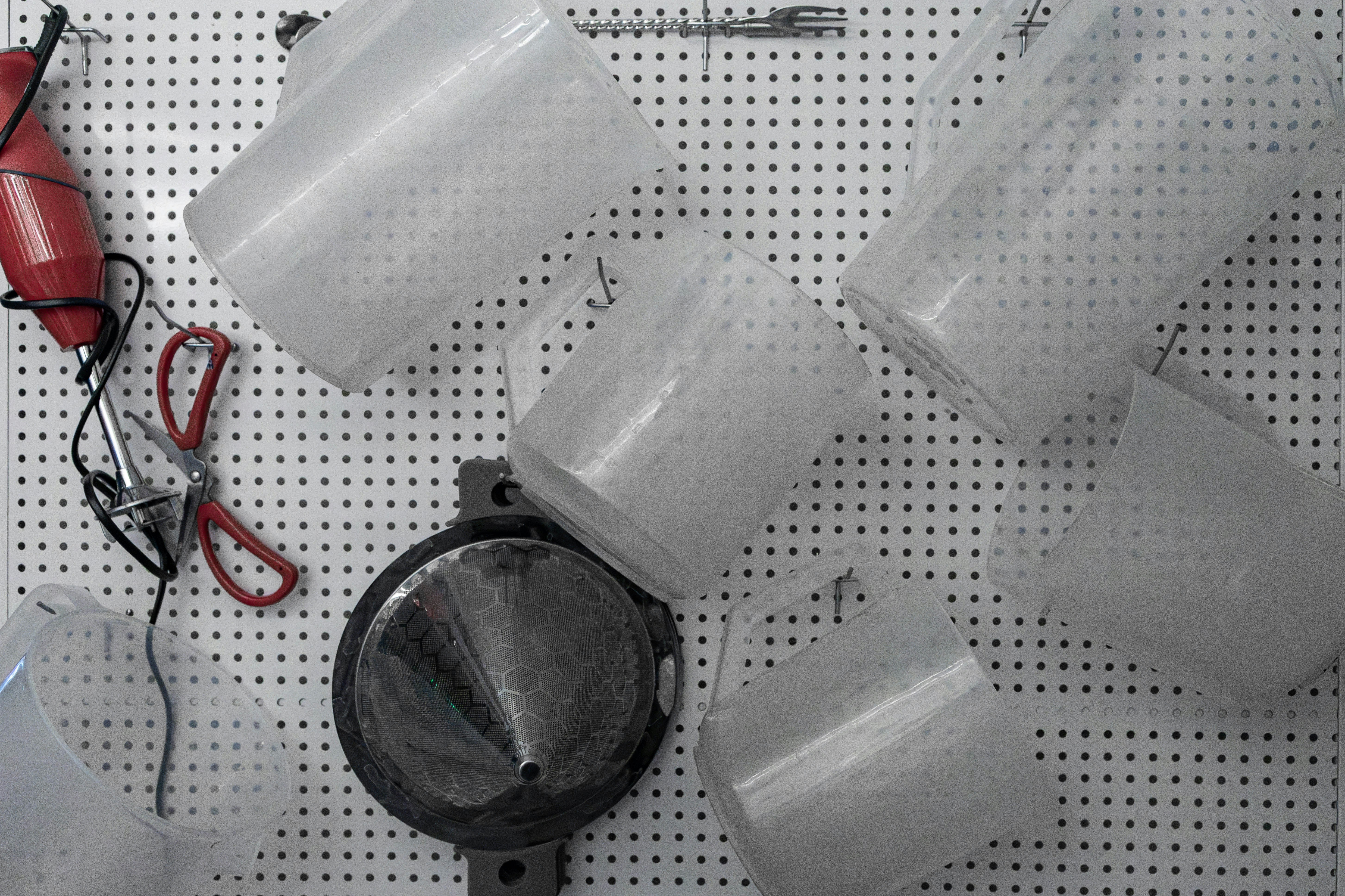 A bunch of cups that are on a wall