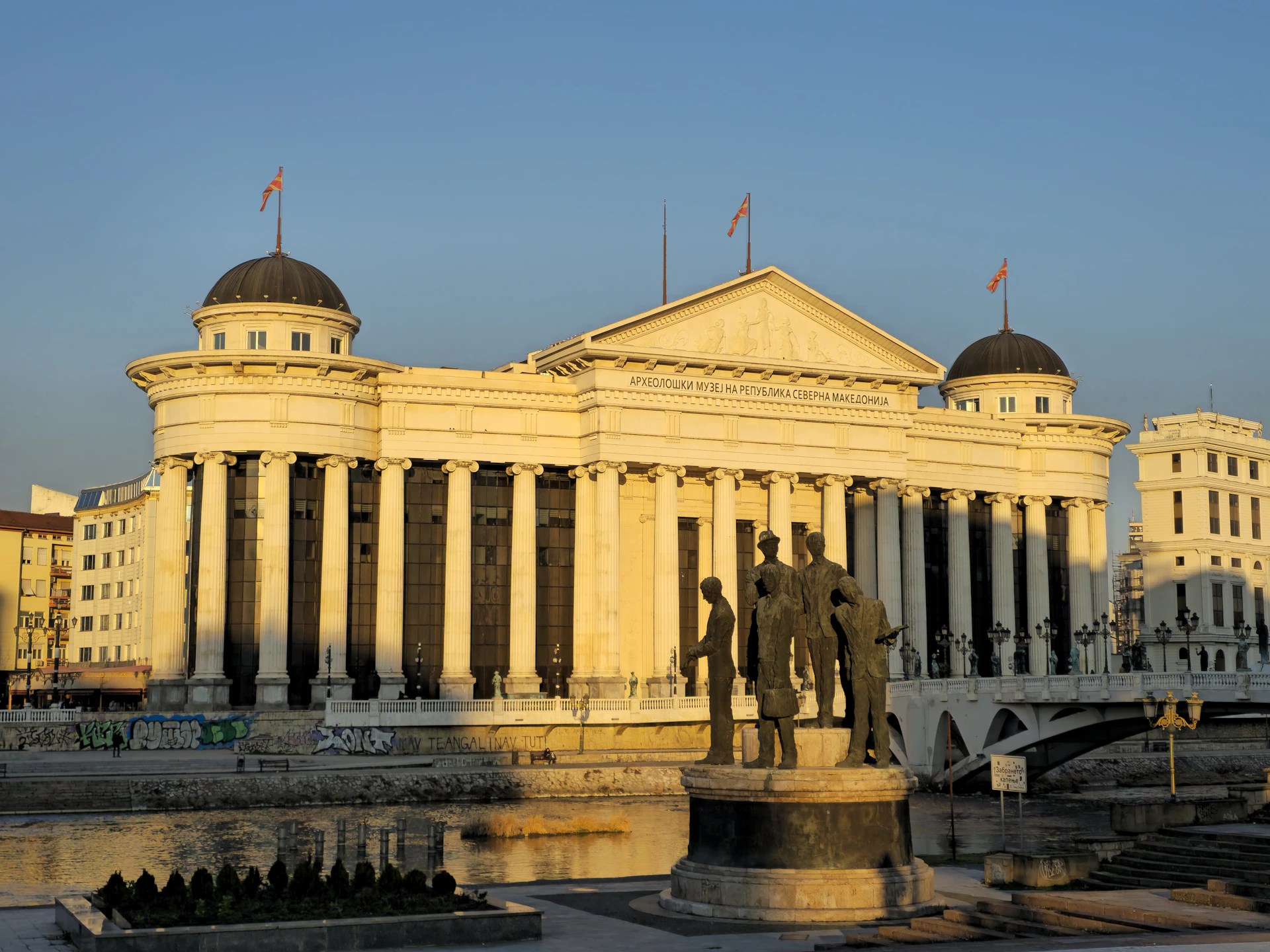A large building with a statue in front of it