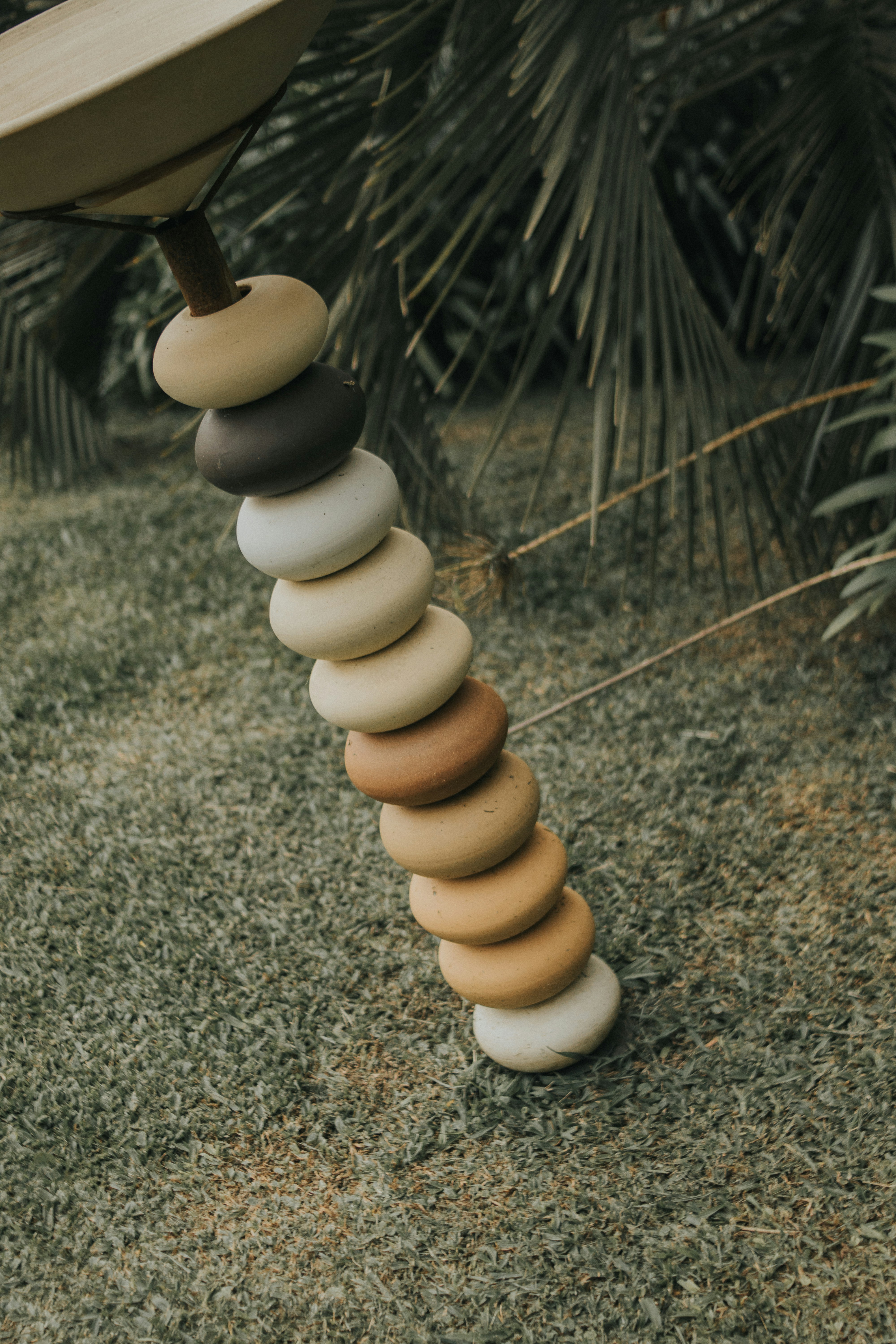 A sculpture made out of different colored stones