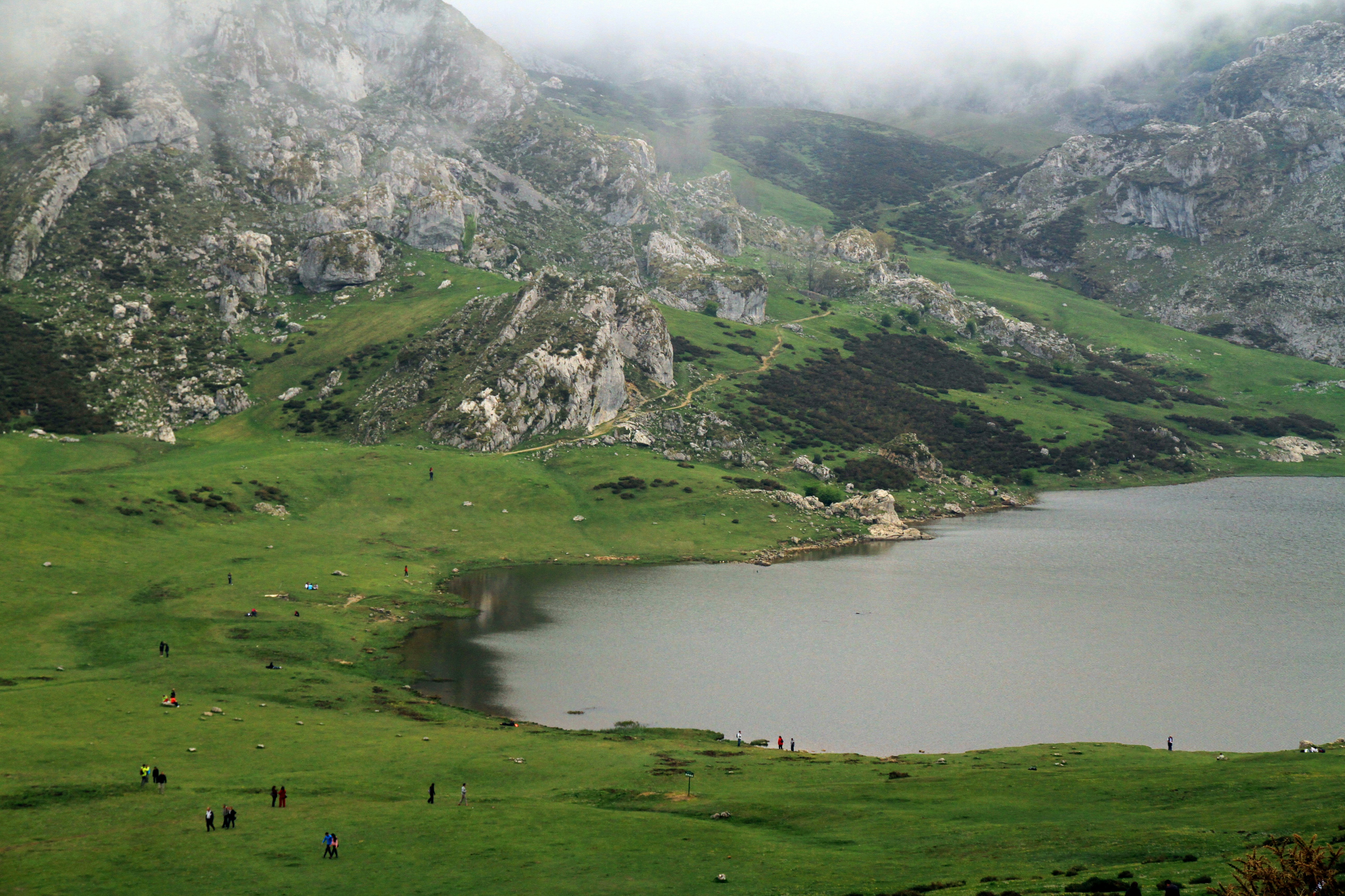 A large body of water surrounded by mountains