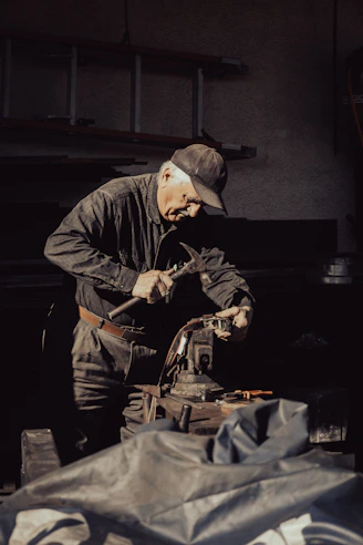 A man working on a machine in a garage