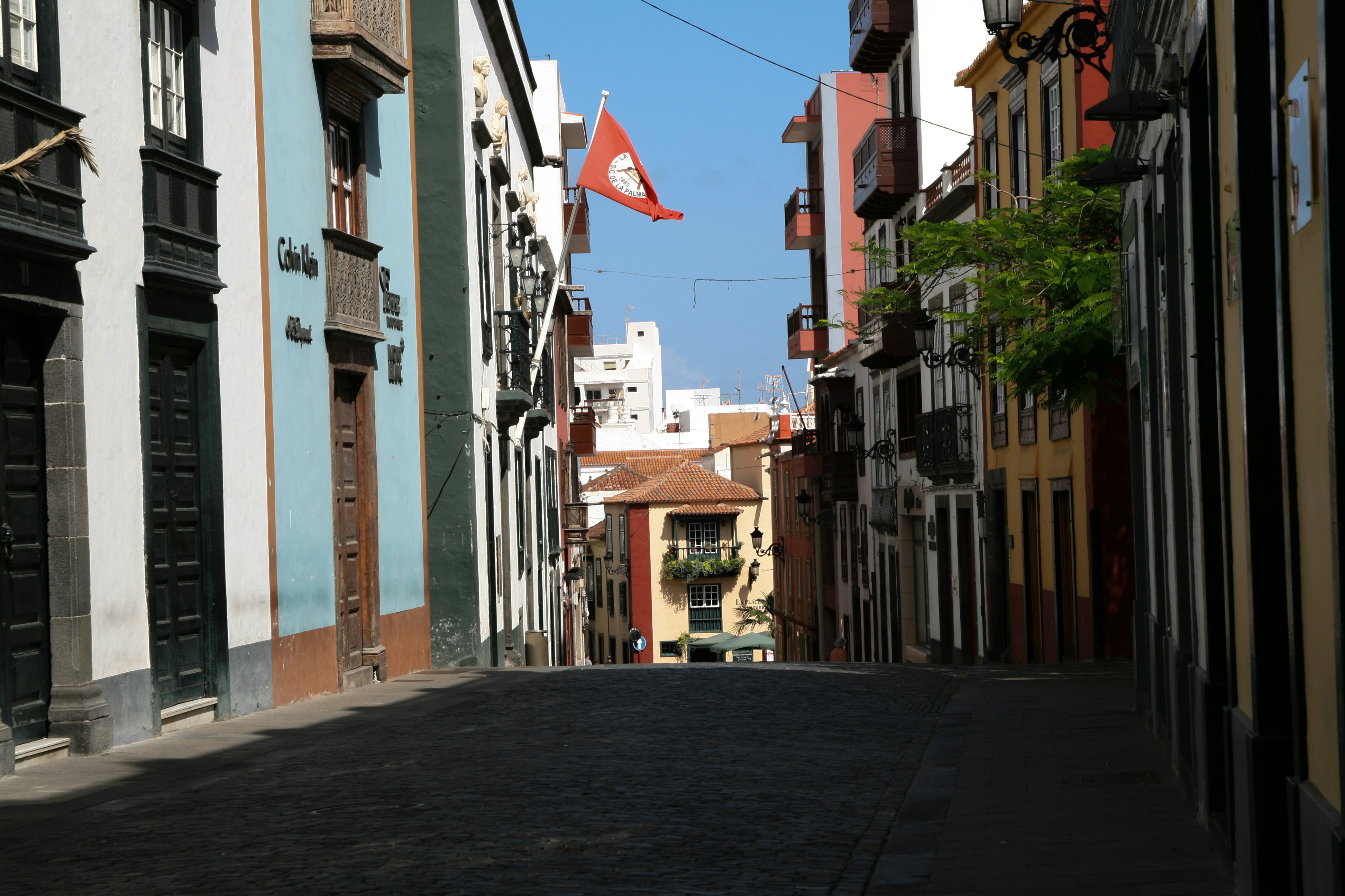 A narrow street with buildings on both sides