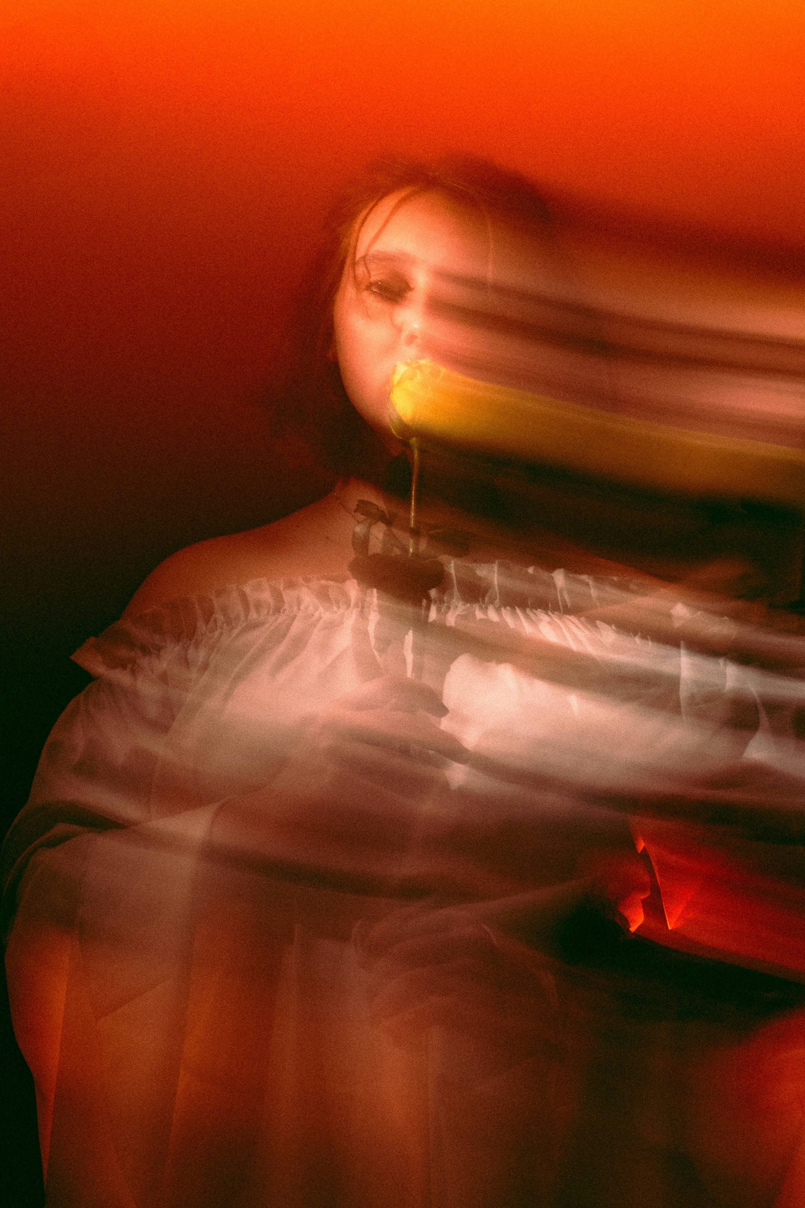 A blurry photo of a person with a cell phone