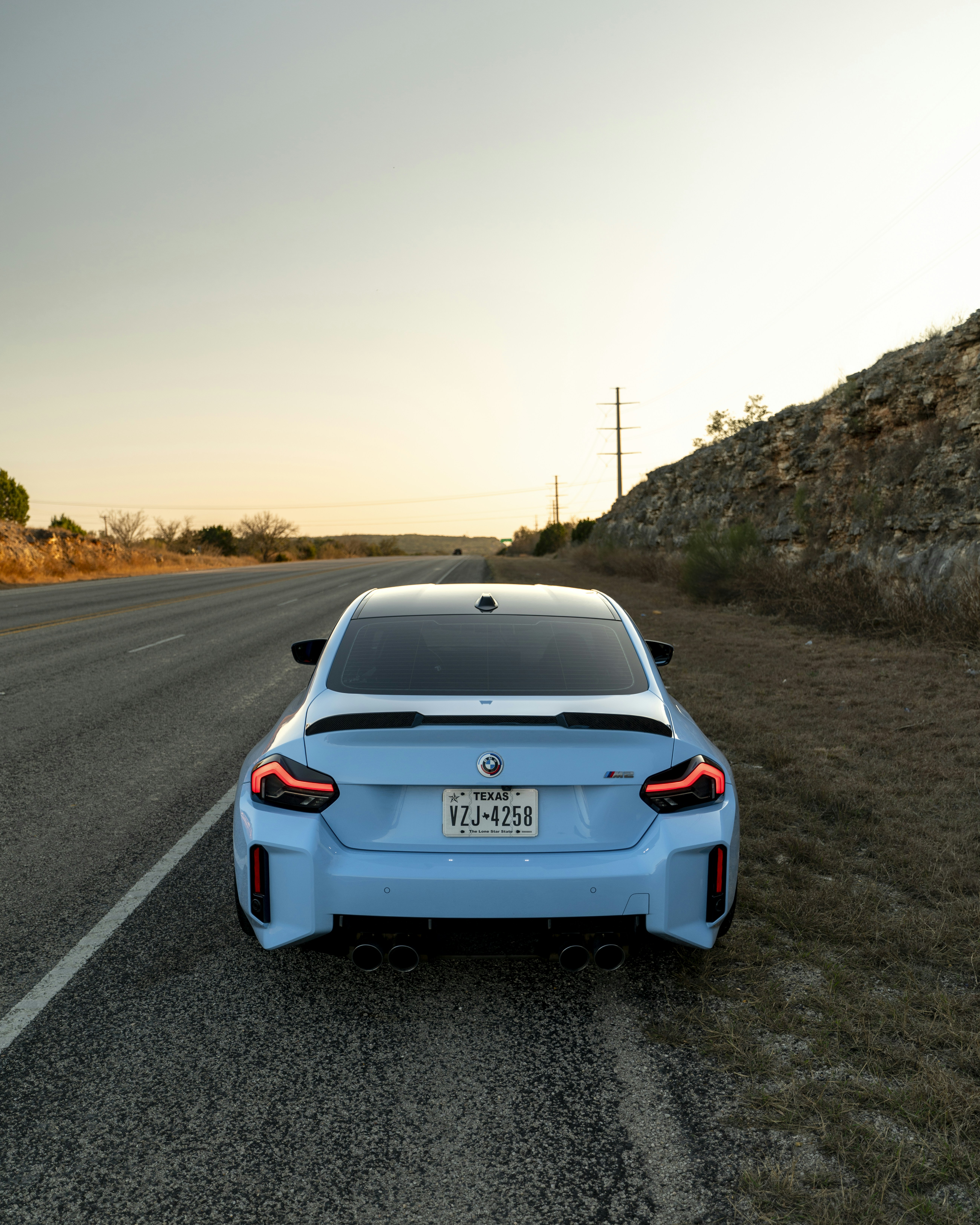 A blue car parked on the side of the road