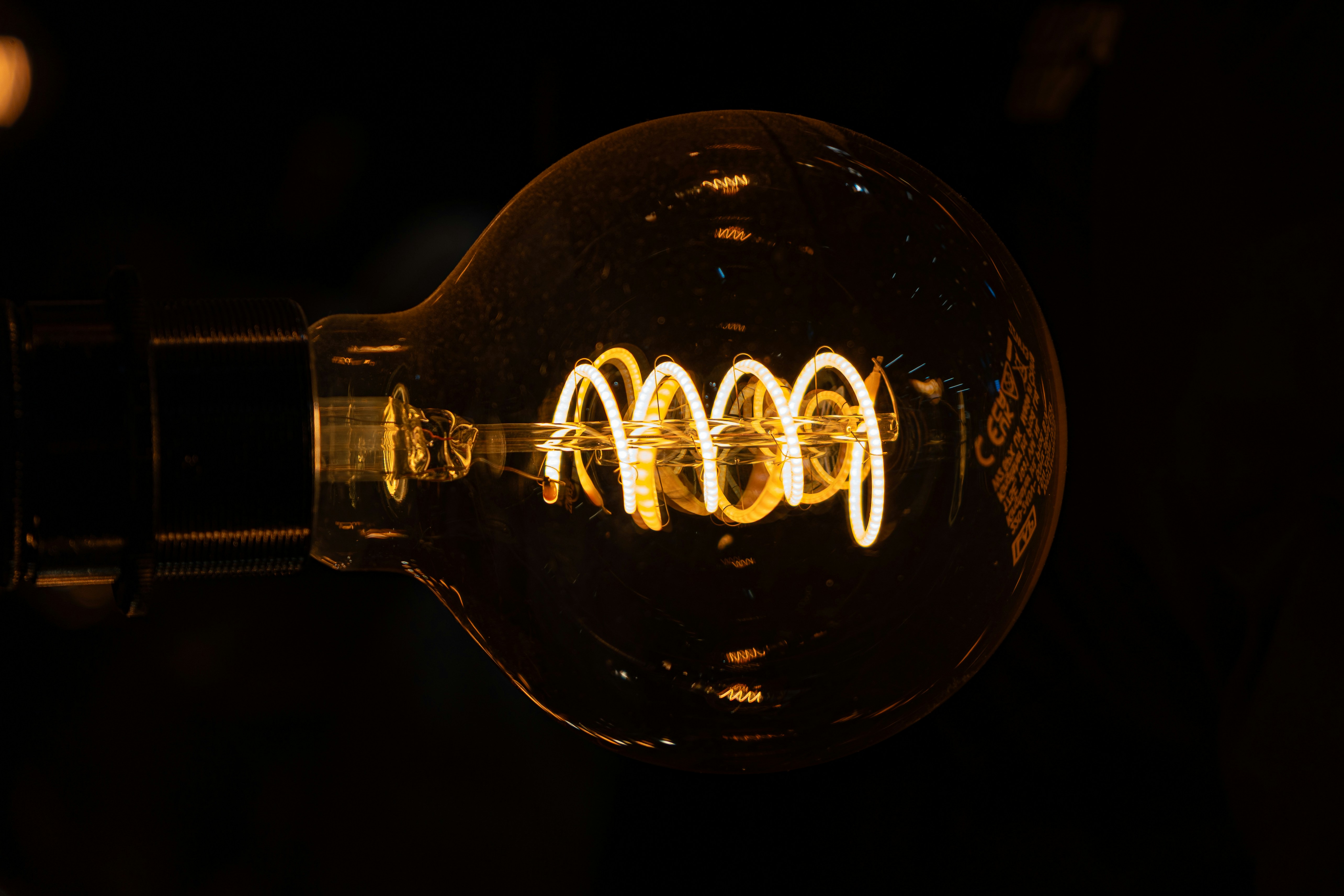 An artistic image of a stylized brain with glowing light bulbs, symbolizing ideas and intelligence.
