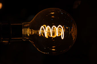 A close up of a light bulb in the dark