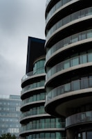 A tall building with many balconies on top of it