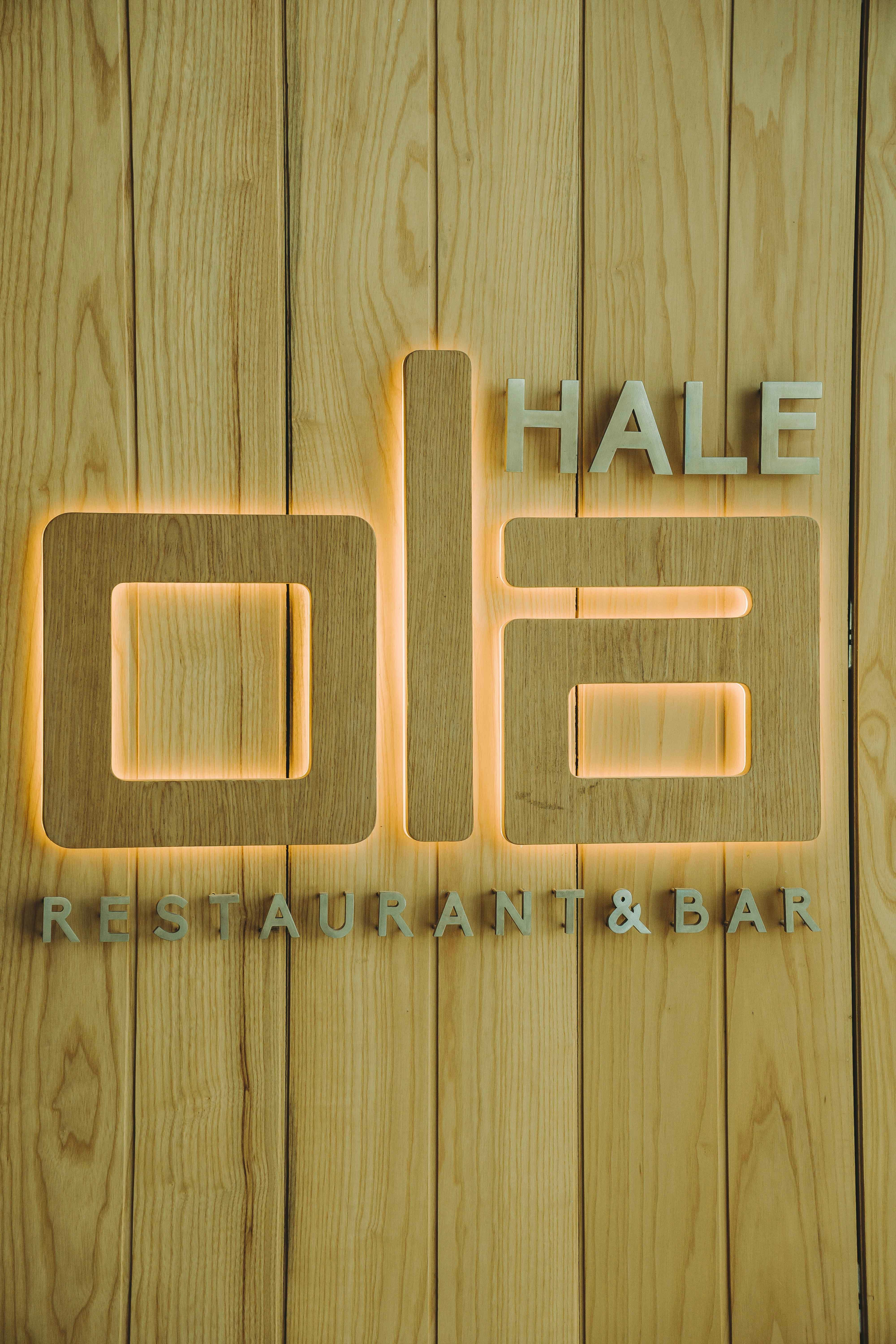 A wooden sign that says hale restaurant and bar