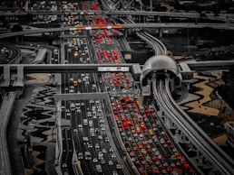 A highway filled with lots of traffic under a cloudy sky
