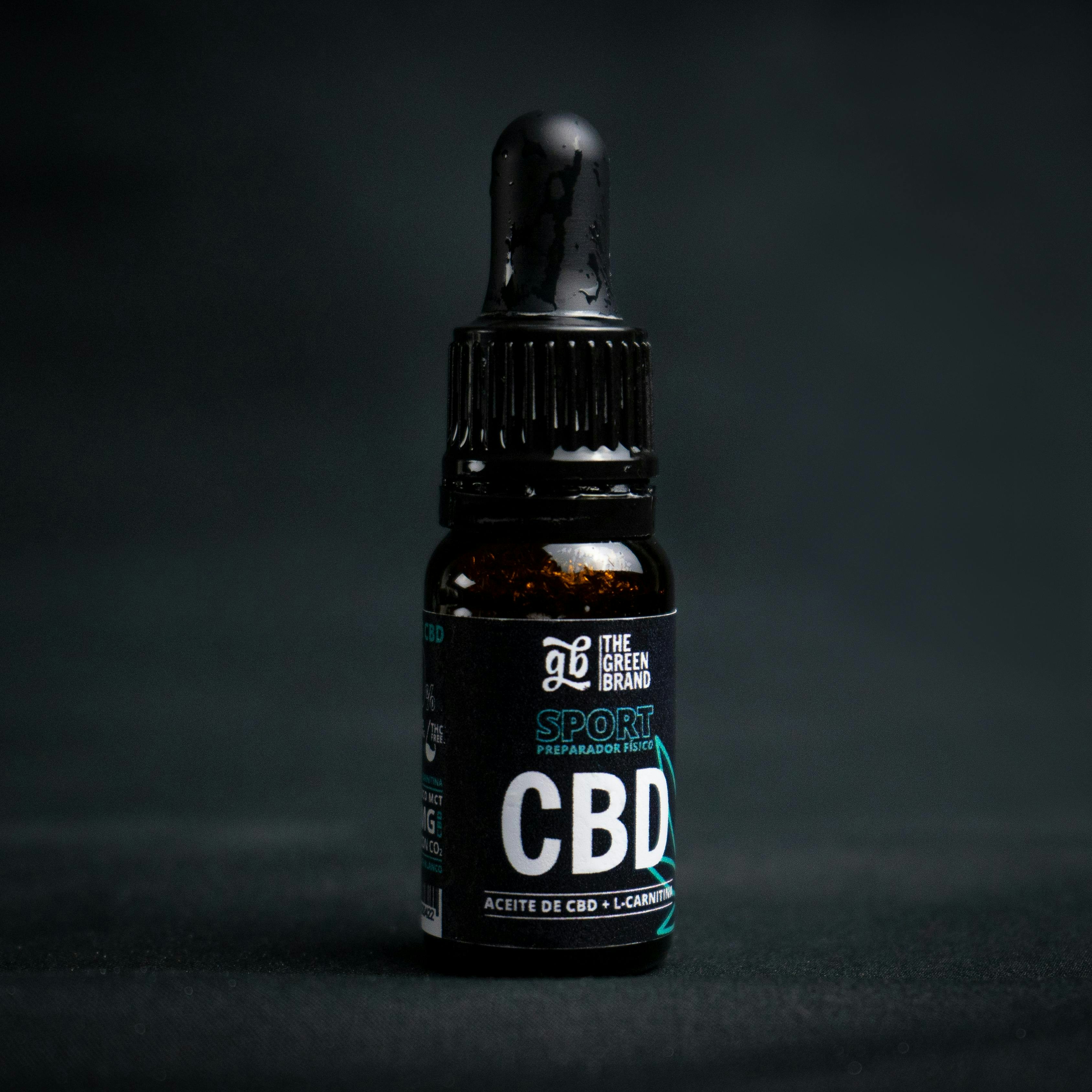 A bottle of cbd sitting on a table