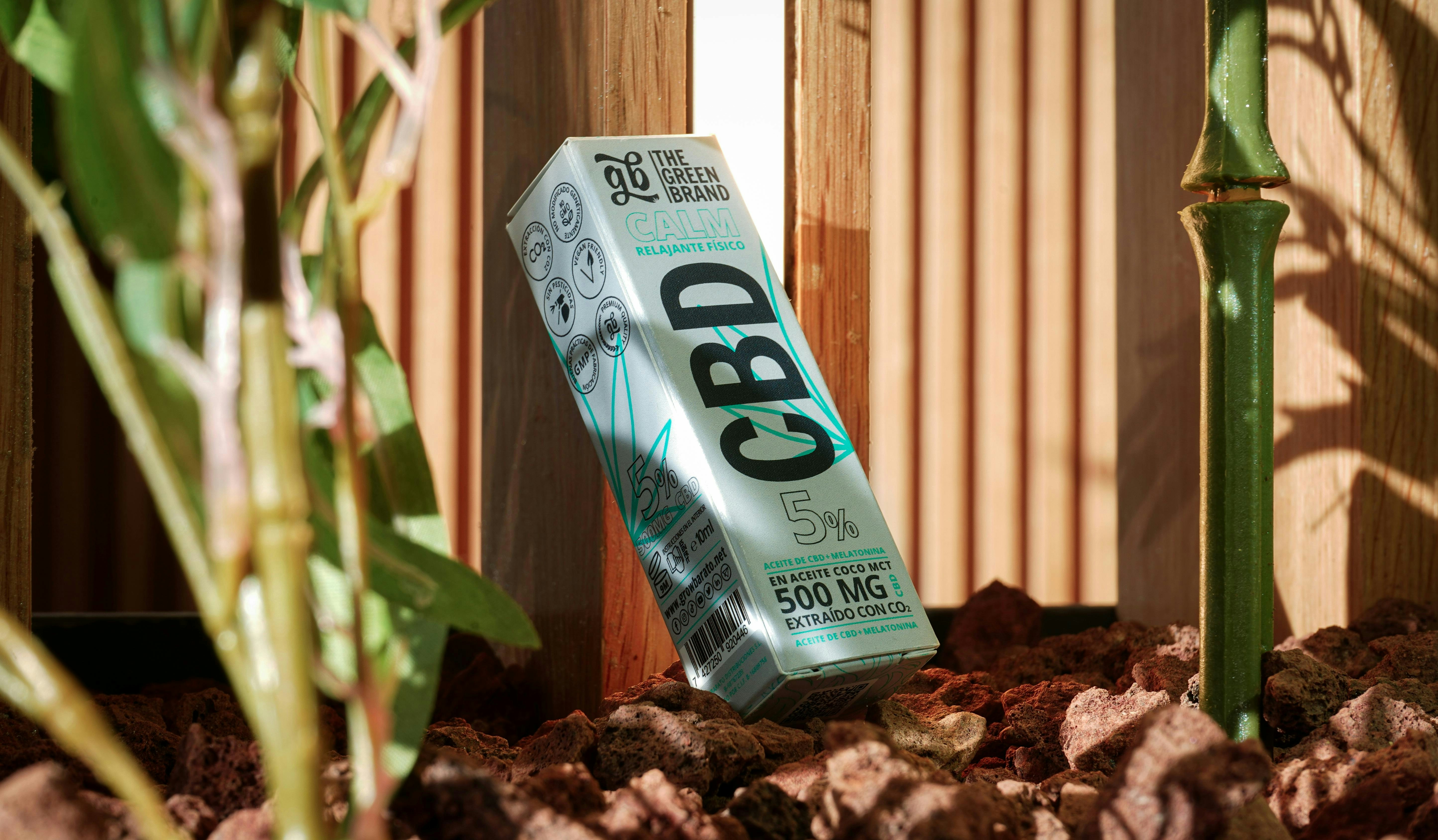 A box of cbd sitting on top of a pile of dirt