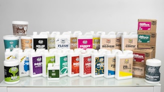 A white table topped with lots of bottles of liquid