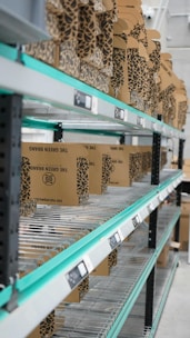 A shelf in a warehouse filled with lots of boxes