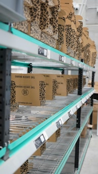 A shelf in a warehouse filled with lots of boxes