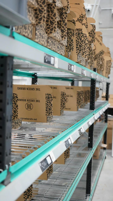 A shelf in a warehouse filled with lots of boxes