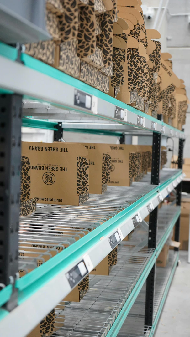 A shelf in a warehouse filled with lots of boxes