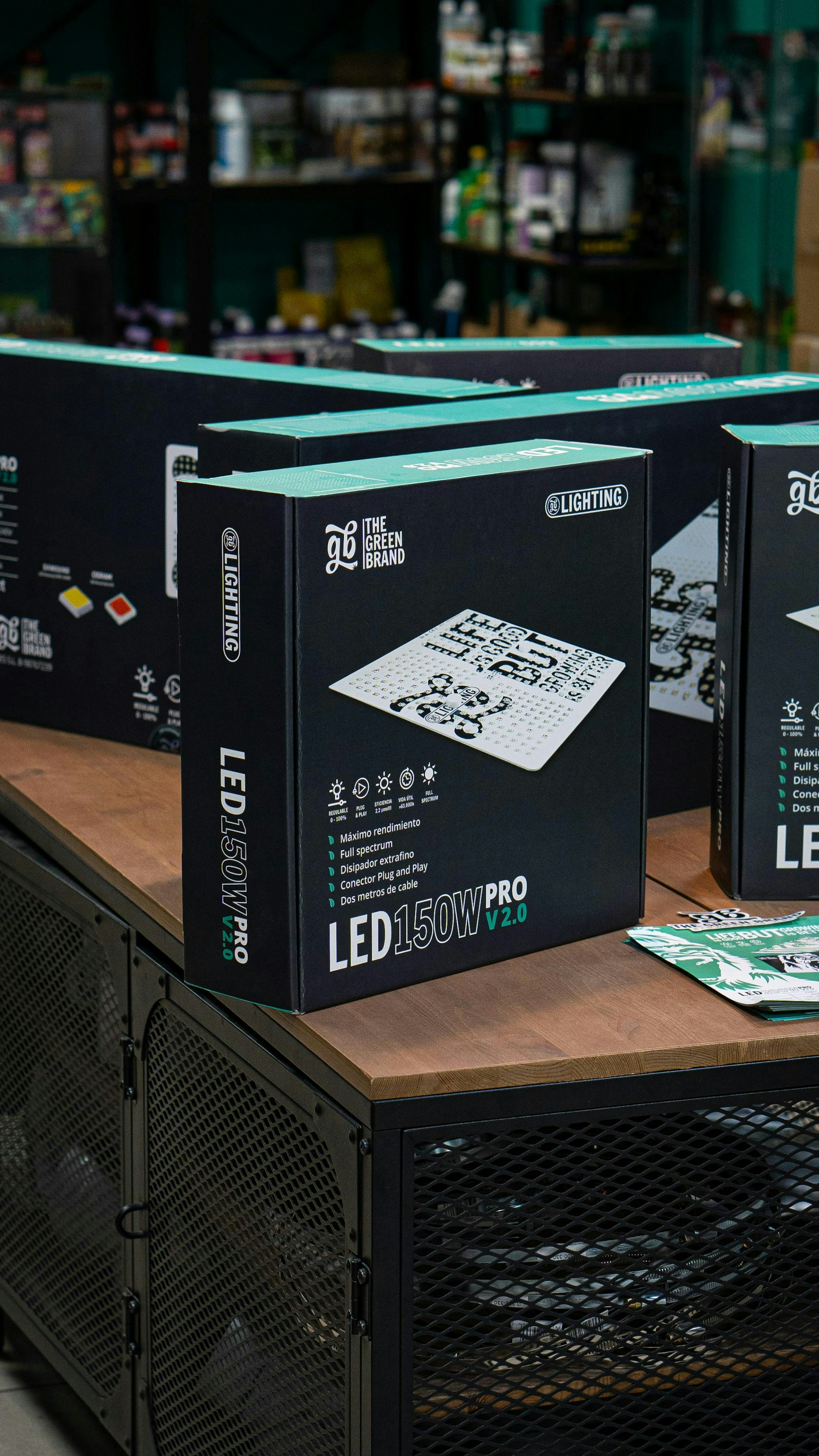 A group of black boxes sitting on top of a wooden table
