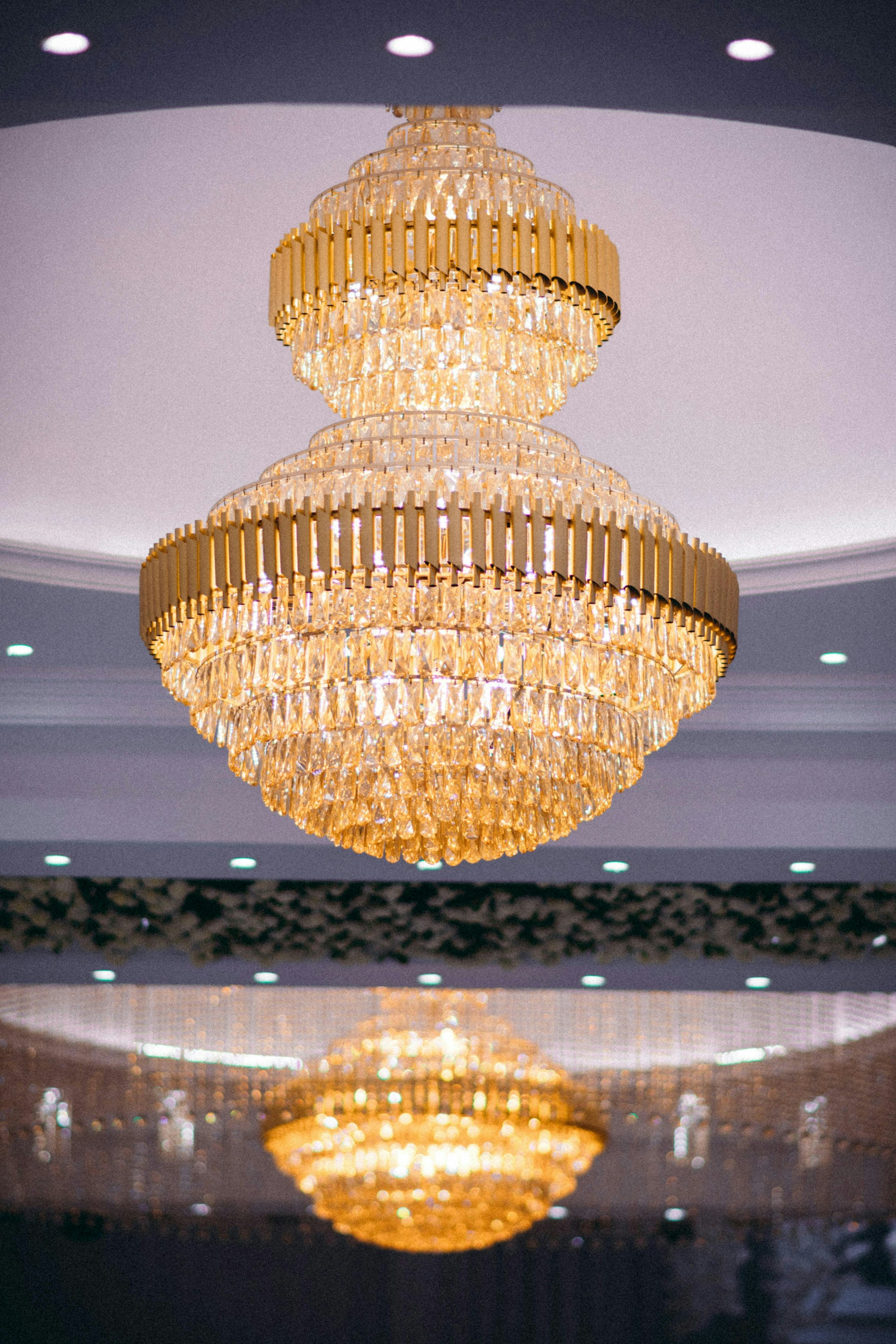 A chandelier hanging from the ceiling in a room