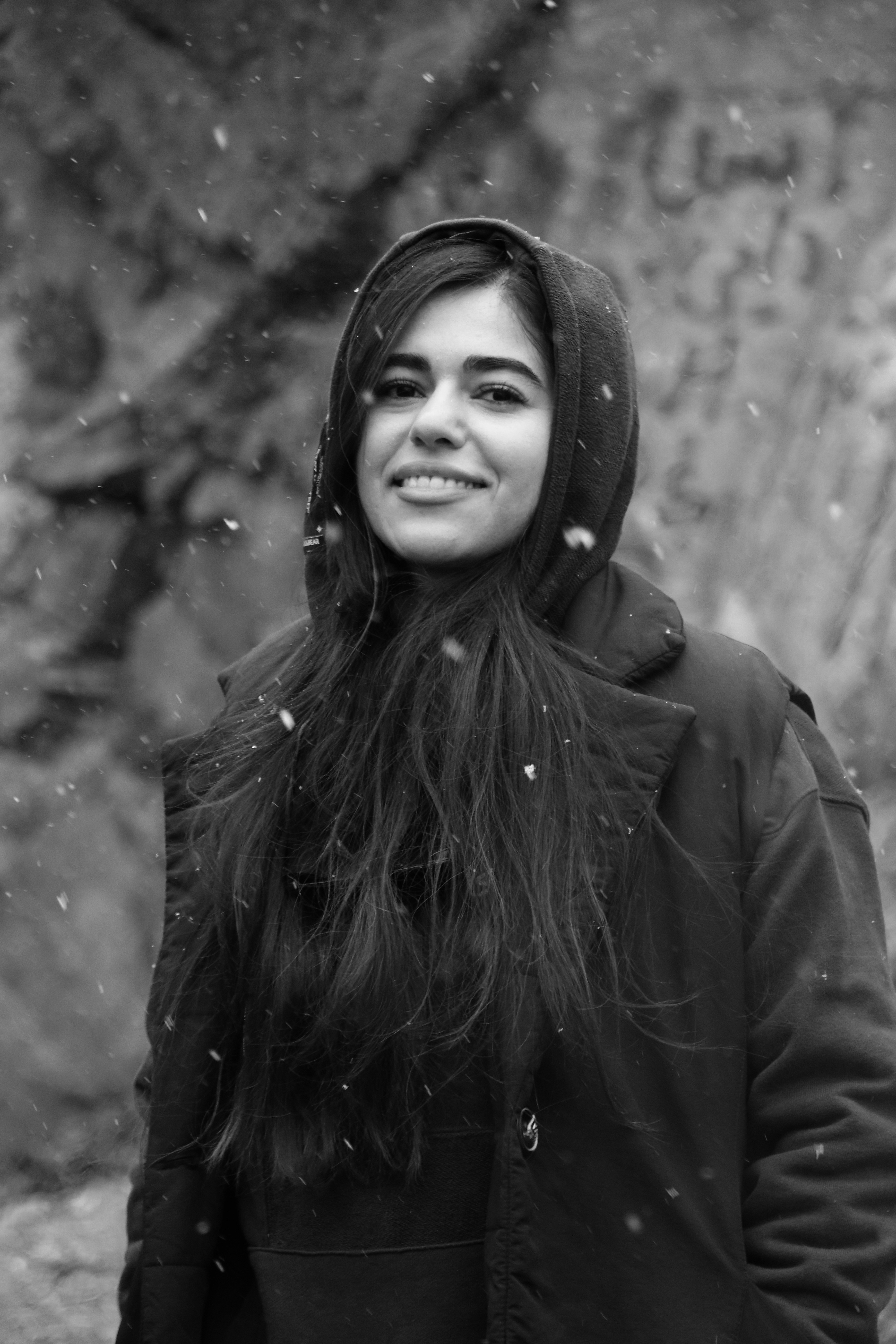 A woman with long hair standing in the snow