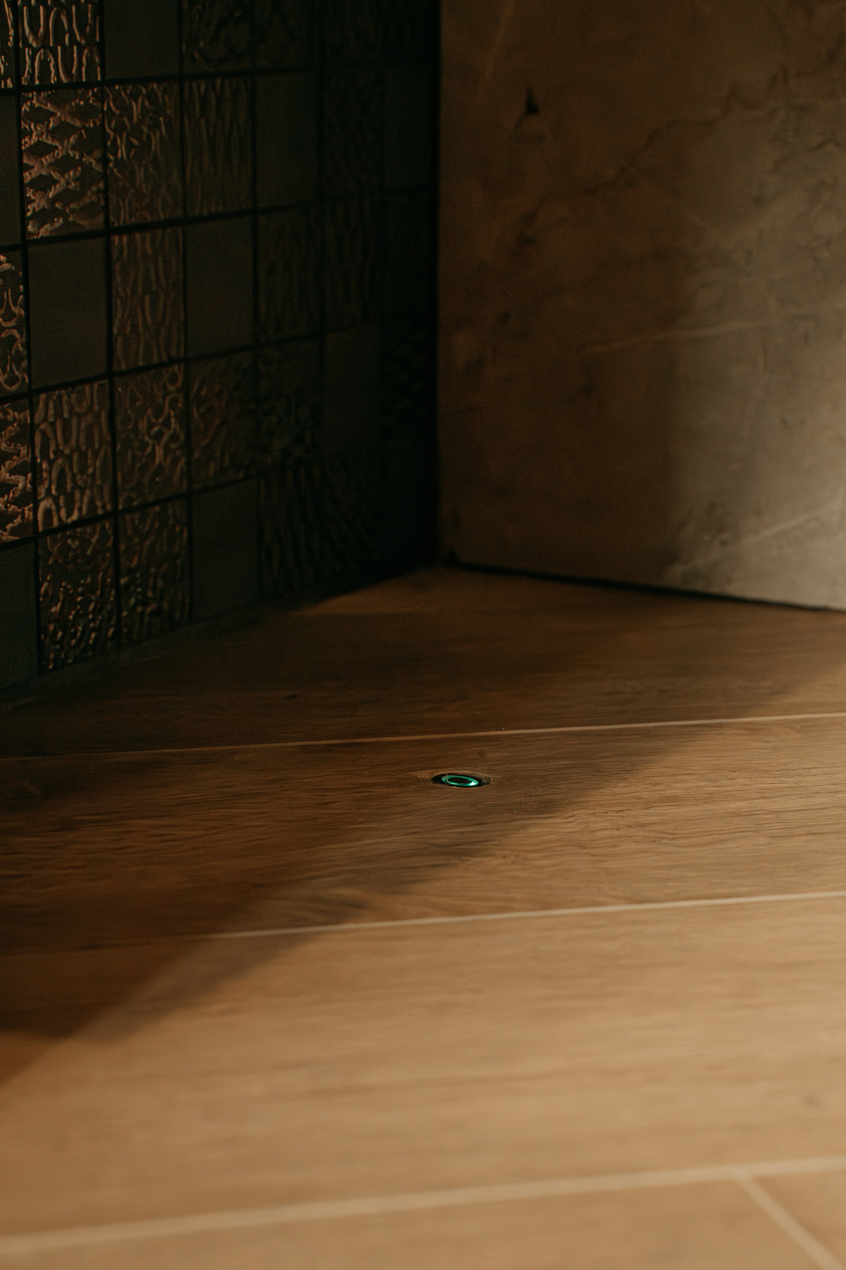 A person on a skateboard on a tiled floor