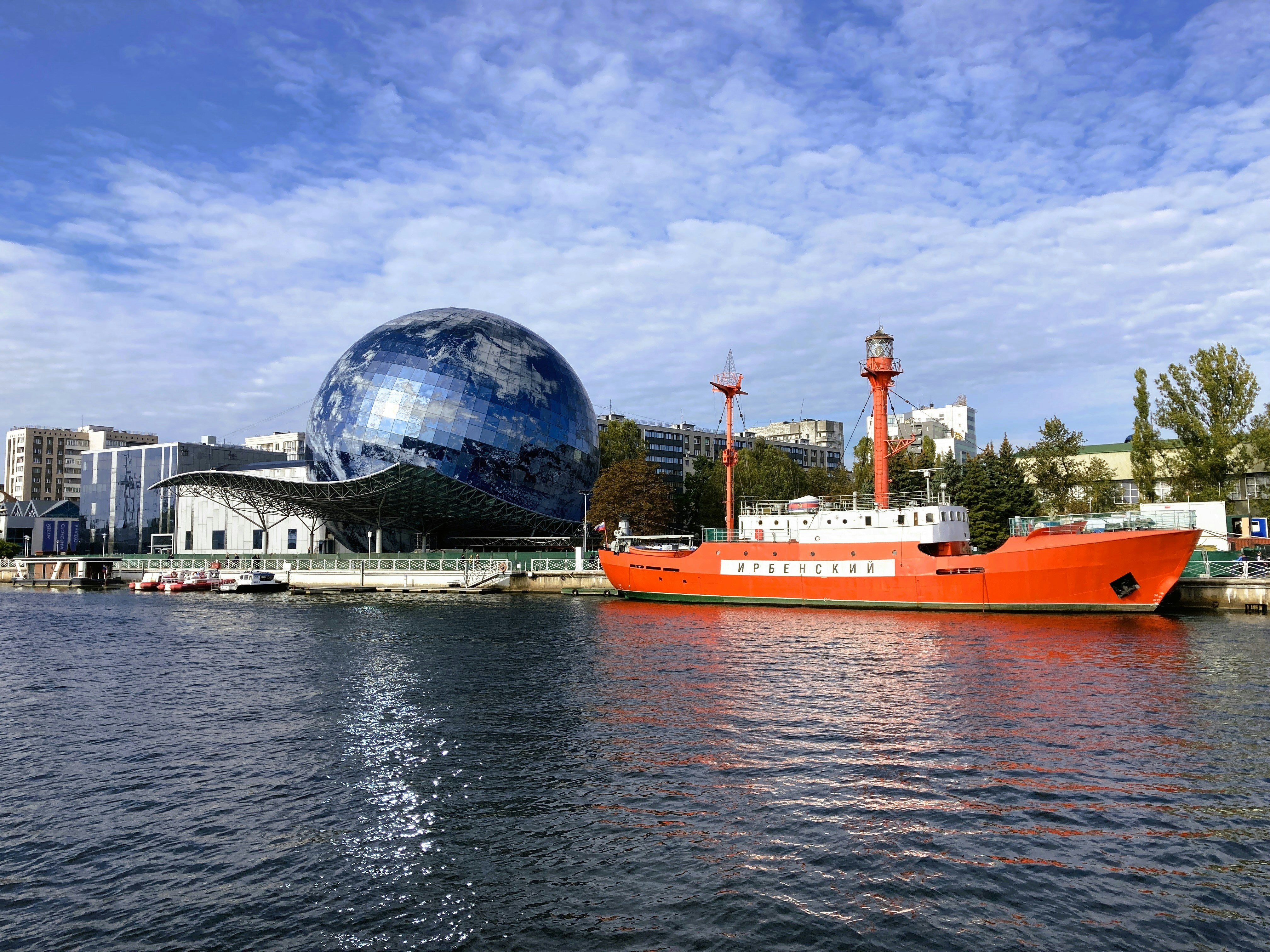 A large boat floating on top of a body of water