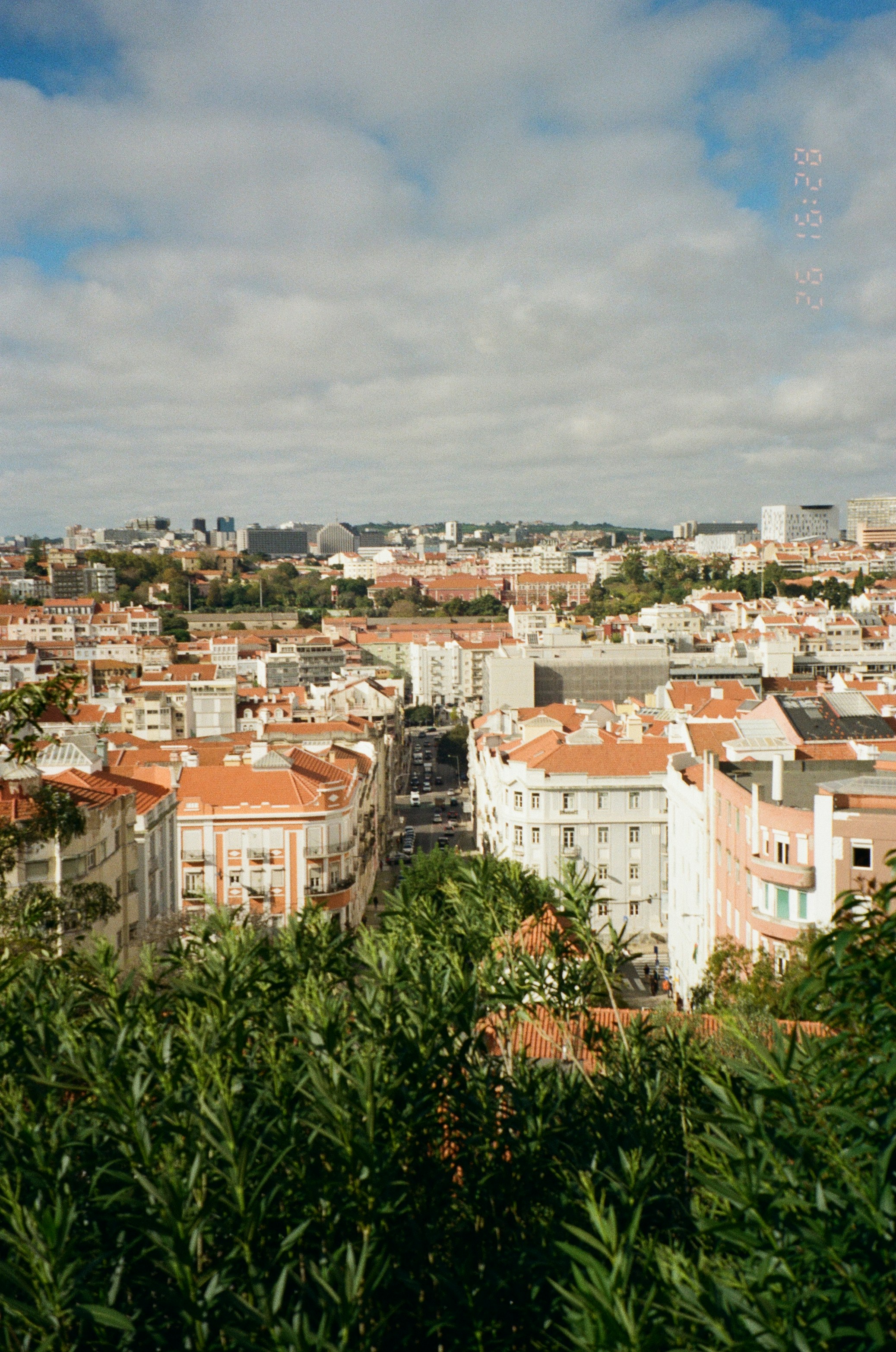 A view of a city from the top of a hill