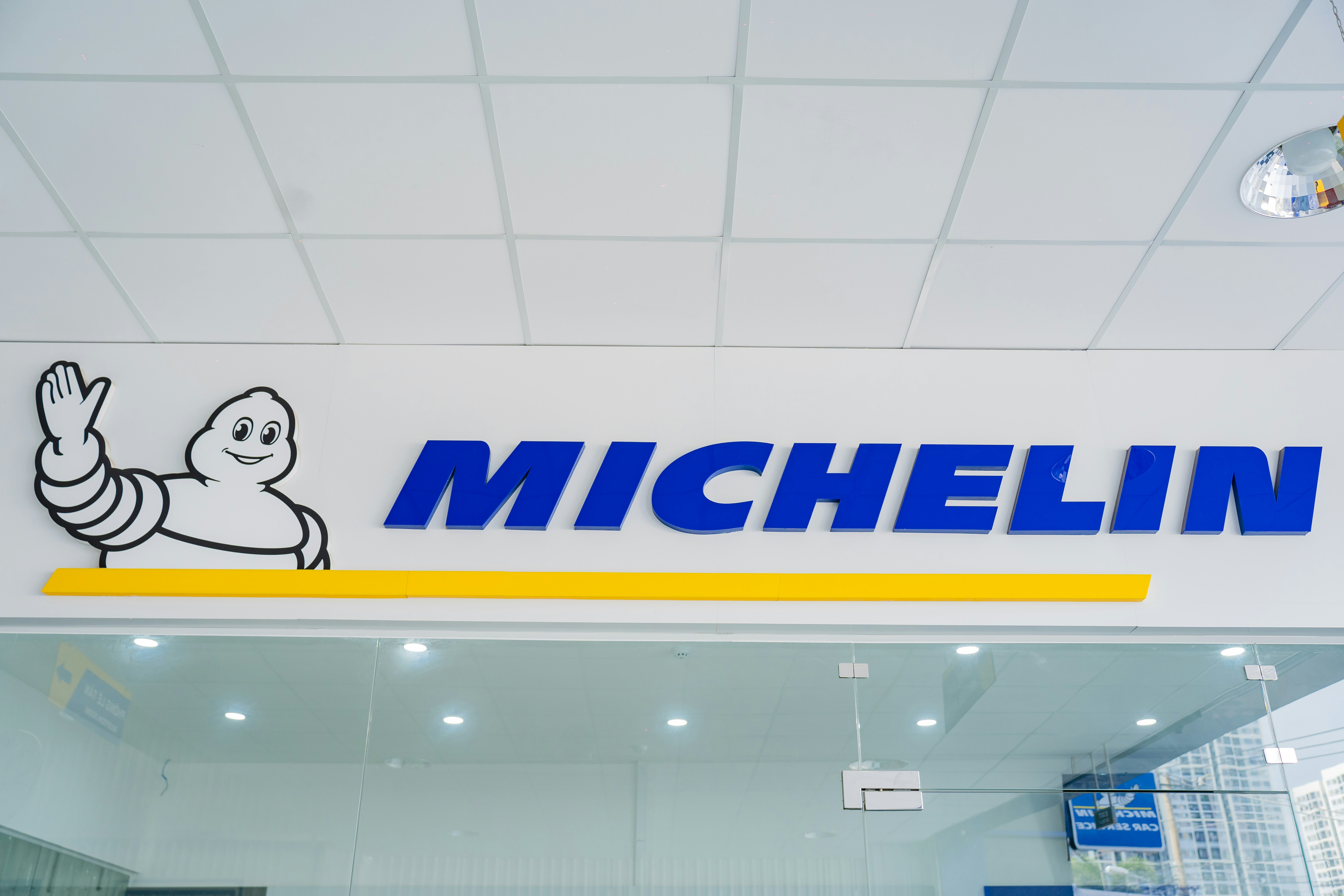 A michel tire store with a large sign above it