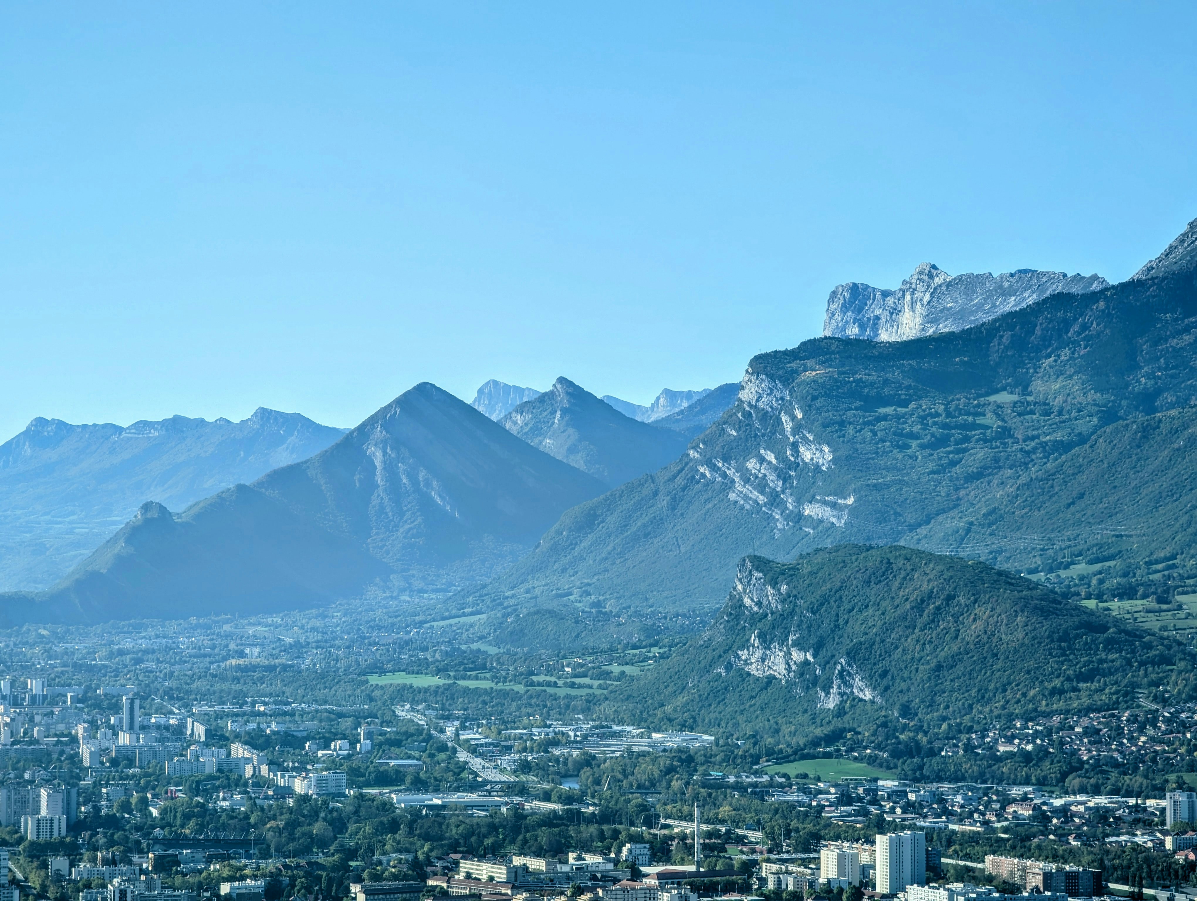 A view of a city with mountains in the background