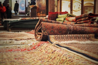 A pile of rugs sitting on top of a floor