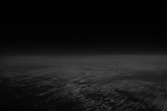 A black and white photo of the earth taken from space
