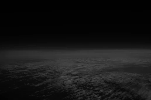A black and white photo of the earth taken from space