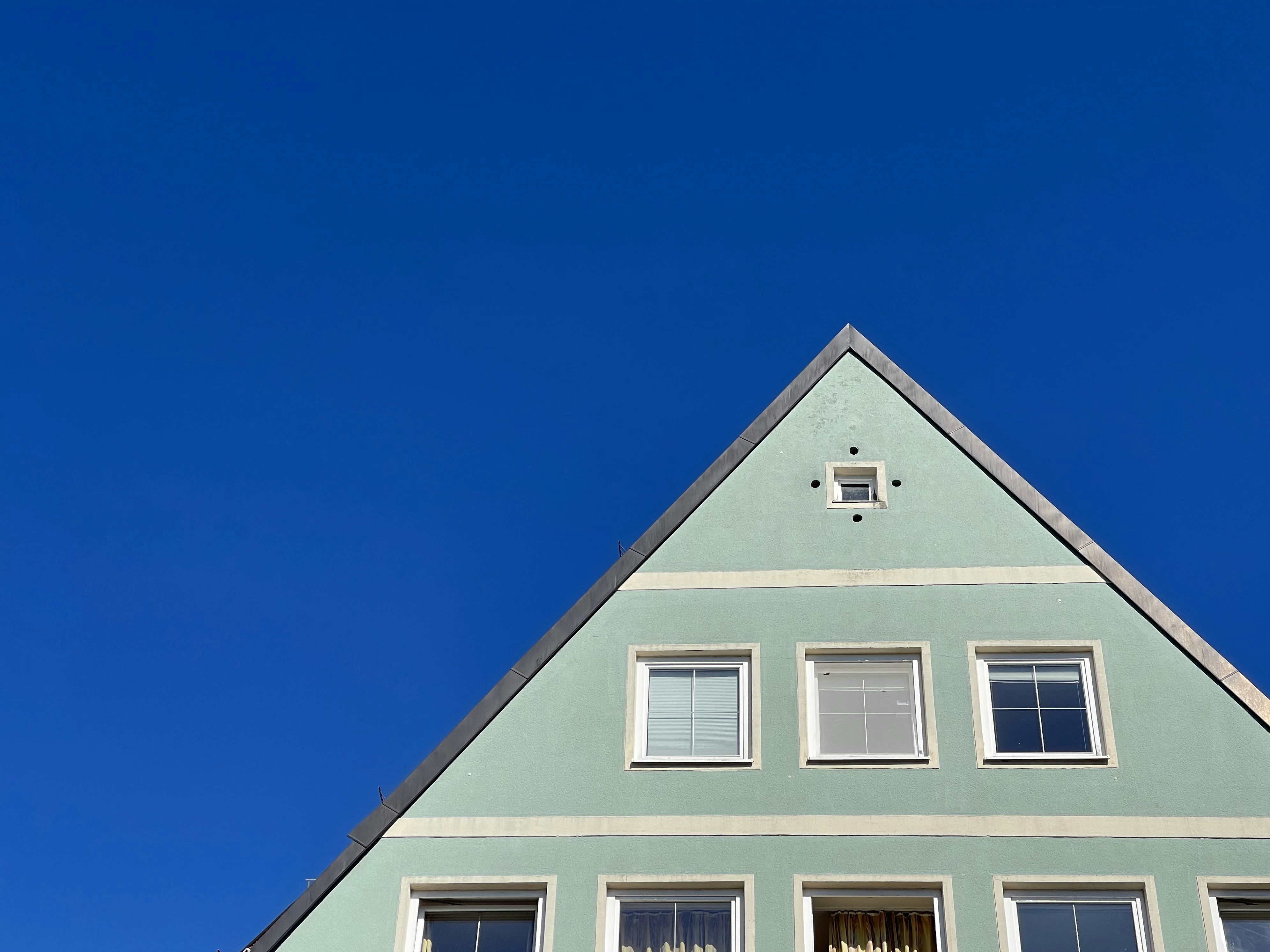 A house with a clock on the front of it