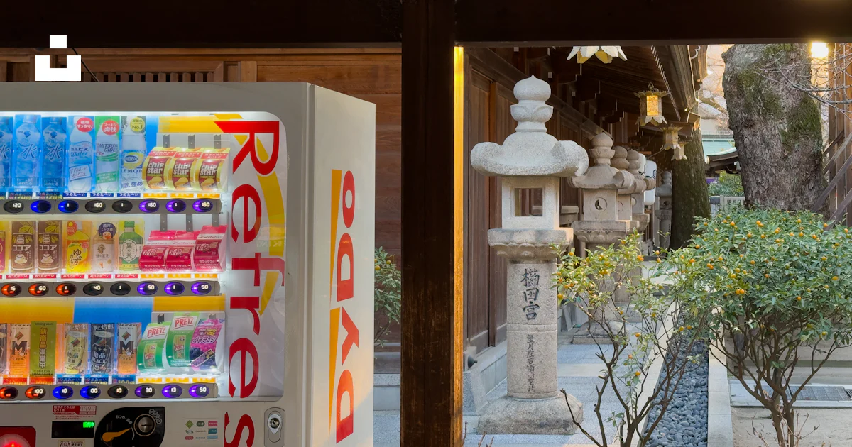 A vending machine sitting in front of a window photo – Free Vending ...