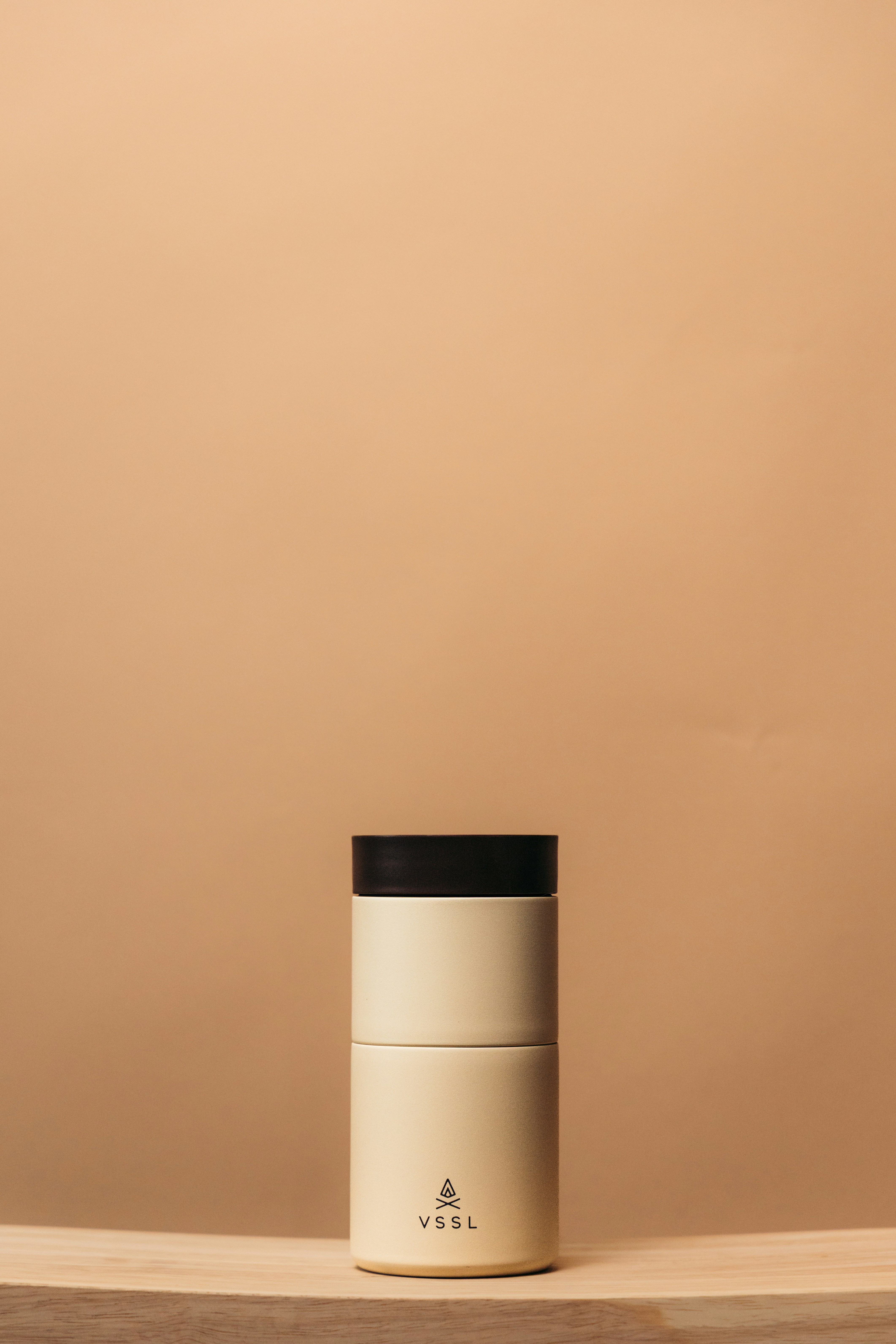 A minimalist and elegant piece of sustainable clothing hanging on a rack, representing the timeless style of Ripley Rader.