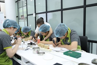 A group of people working on something on a table