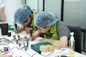 A group of people working on a project at a table