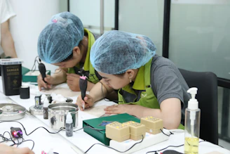 A group of people working on a project at a table