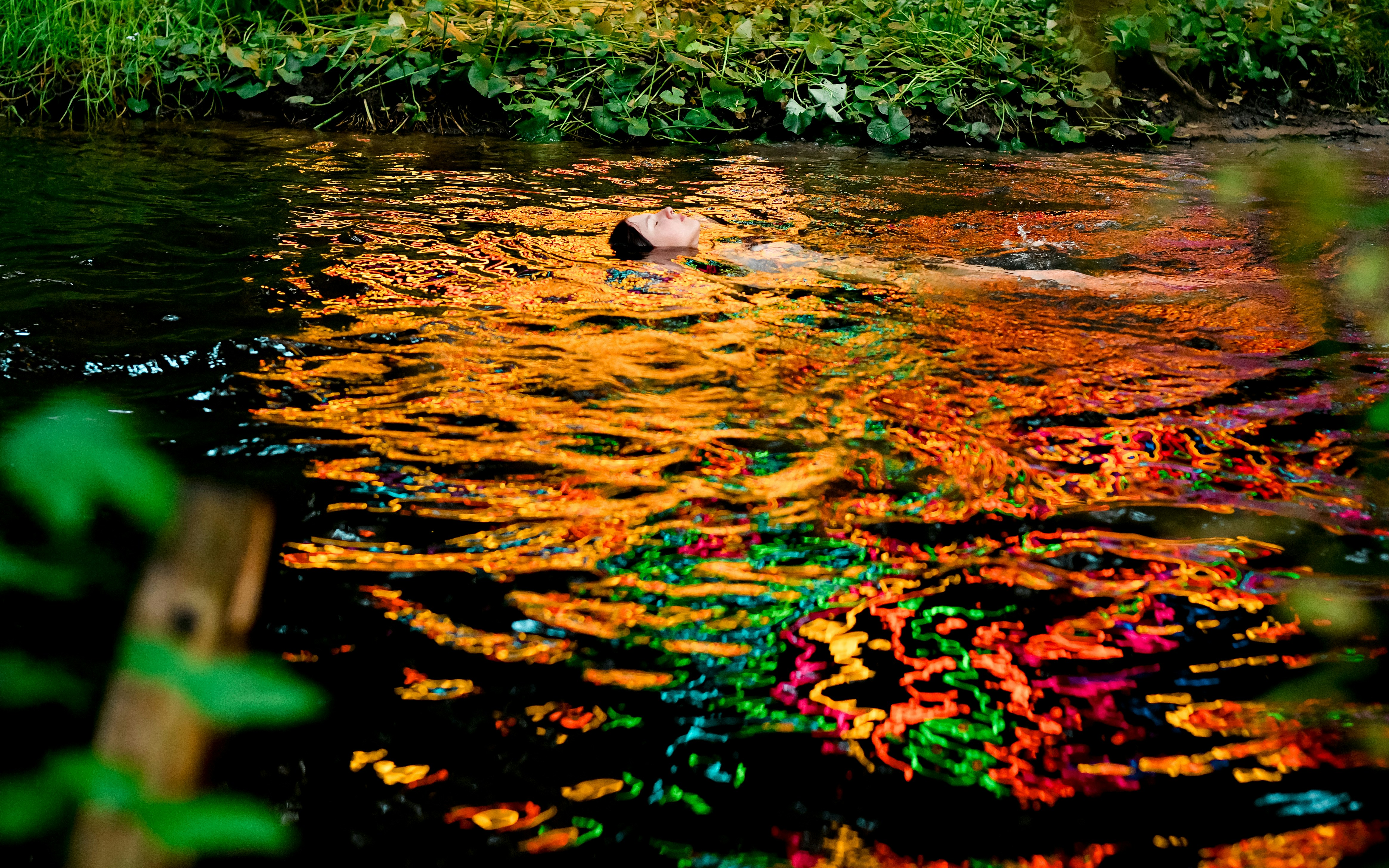 A person swimming in a body of water